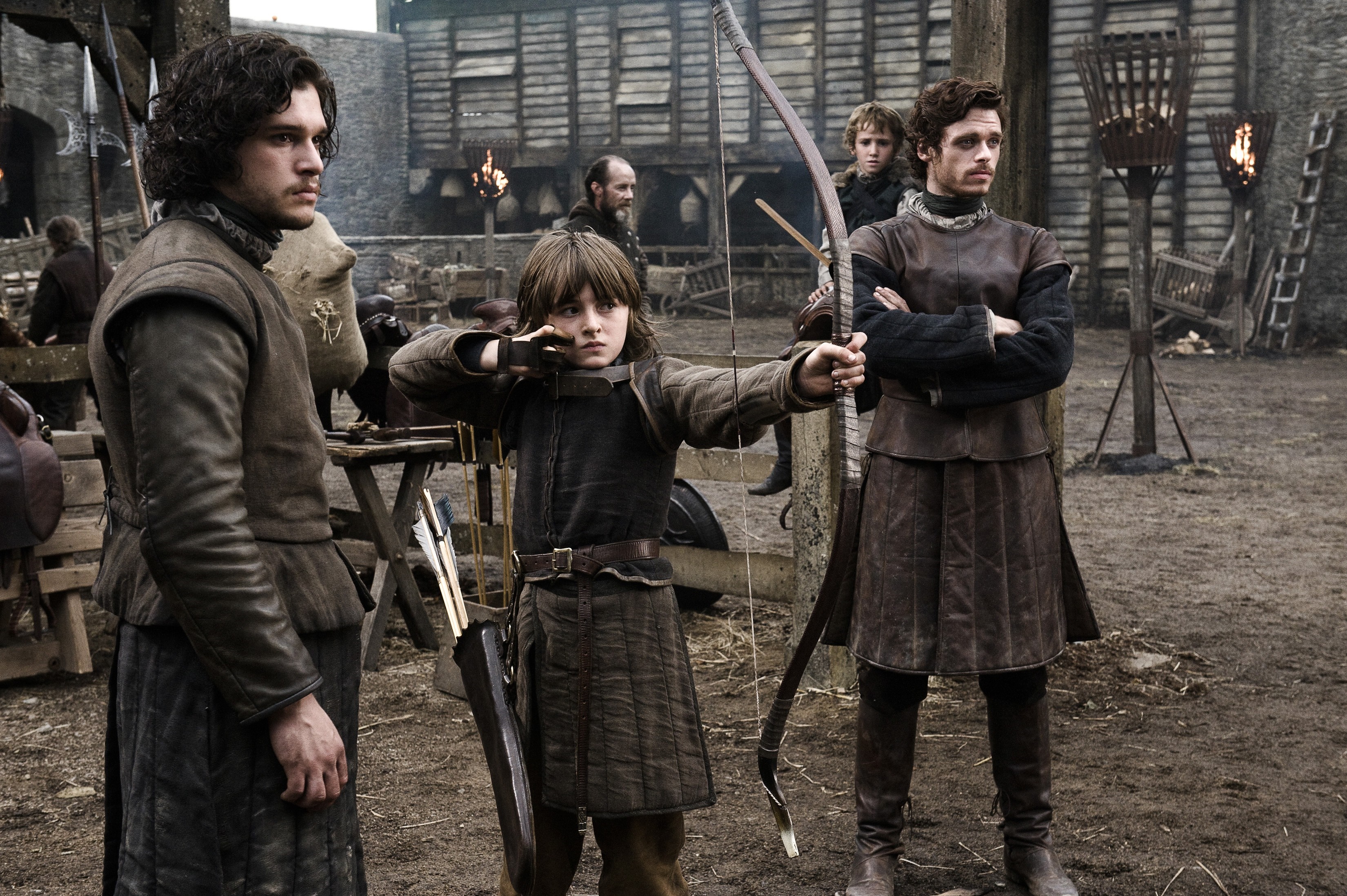 Jon Snow and Robb Stark watch Bran Stark practice archery in Game of Thrones HD Wallpaper
