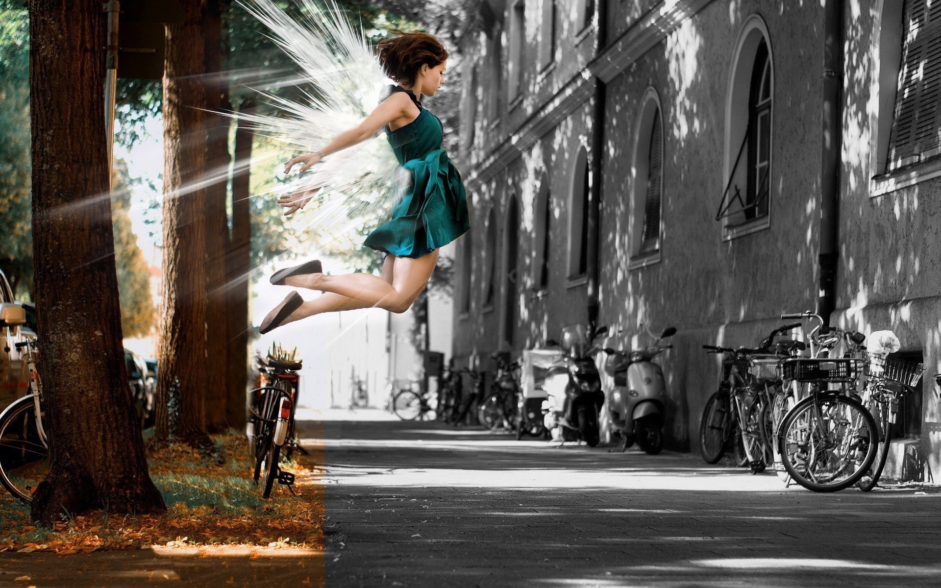 Woman with angel wings jumping on a street HD Wallpaper