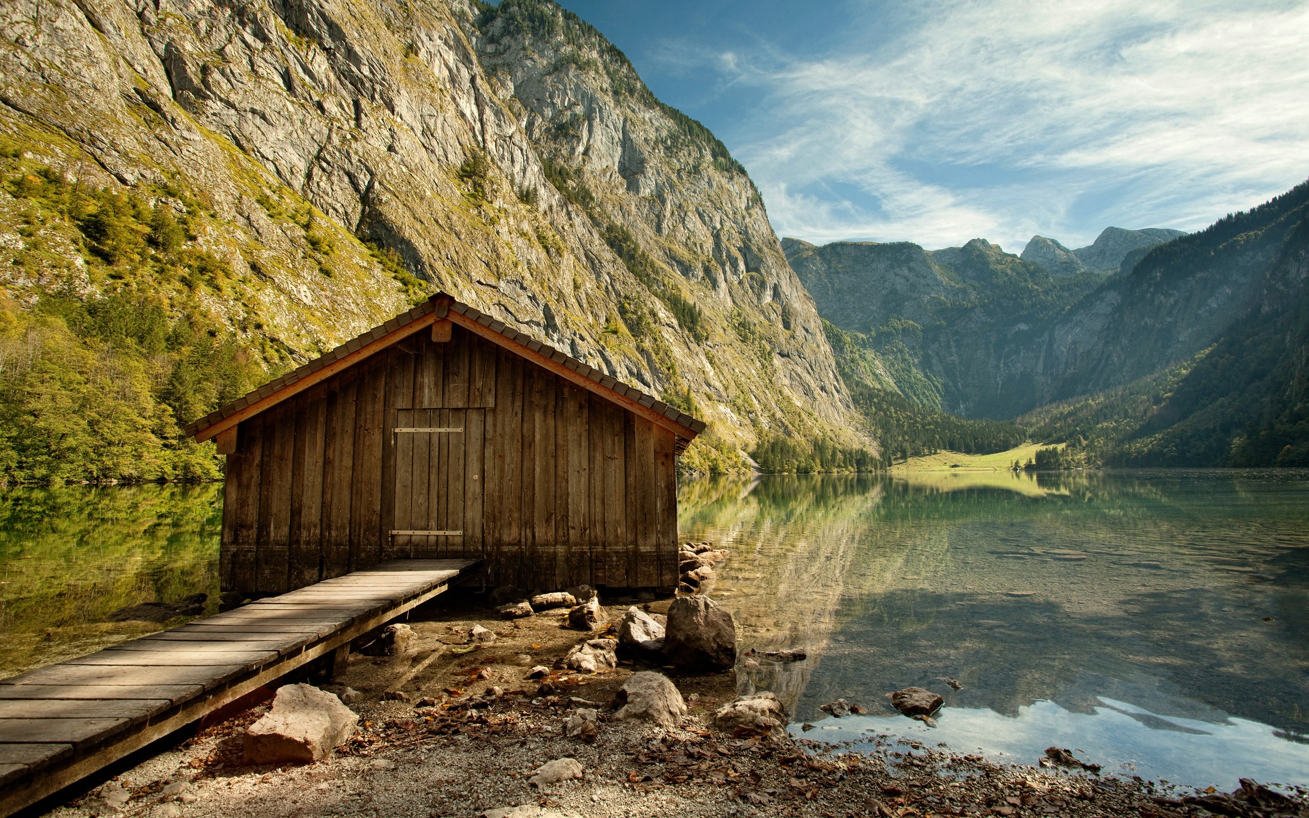 Wooden hut on a lake with mountains HD Wallpaper