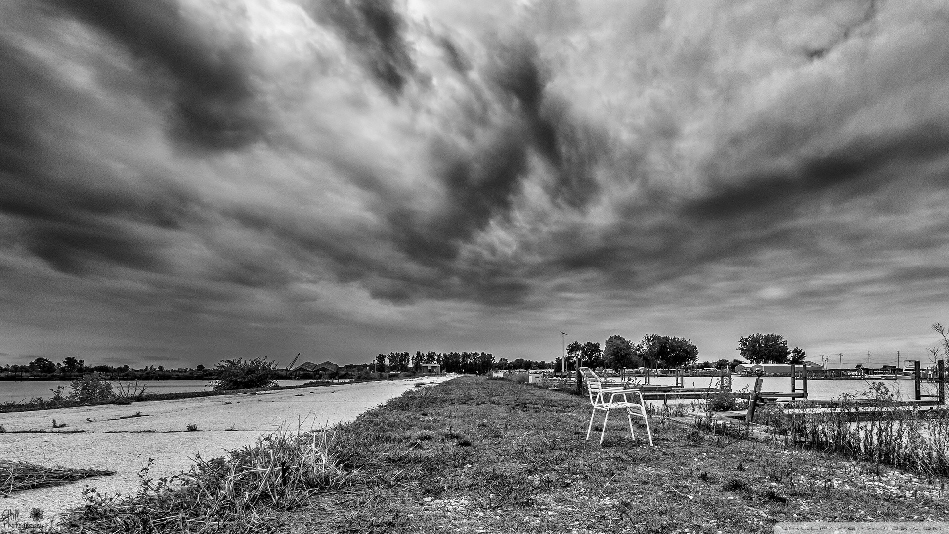 Monochrome landscape with dramatic clouds over water HD Wallpaper