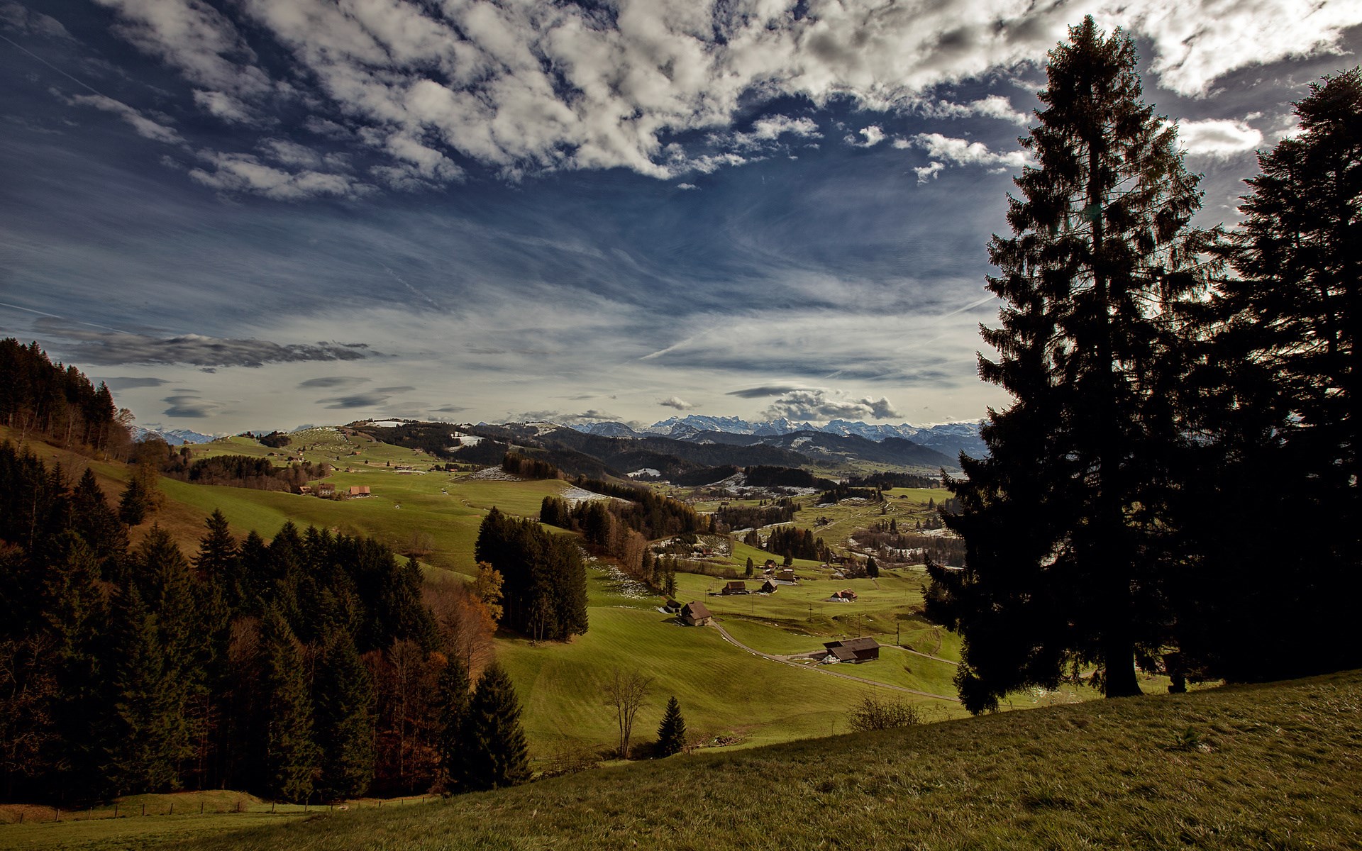 Panoramic view of a rural landscape with mountains in the distance HD Wallpaper