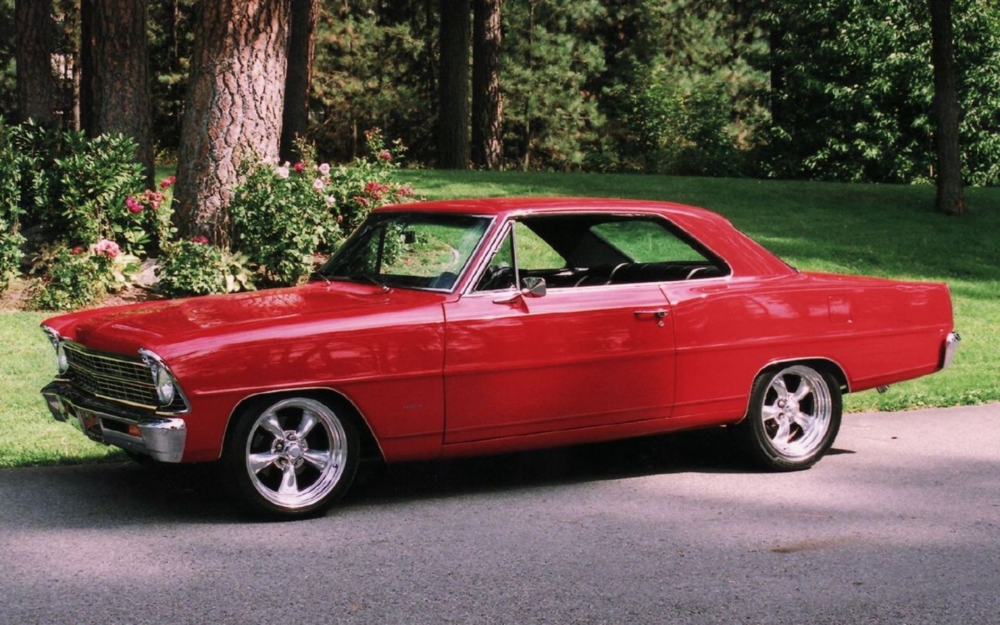 Red Chevrolet Nova parked on a paved road HD Wallpaper
