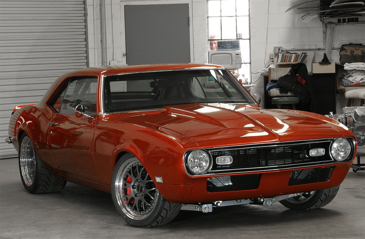 Orange 1967 Chevrolet Camaro Coupe in a garage HD Wallpaper