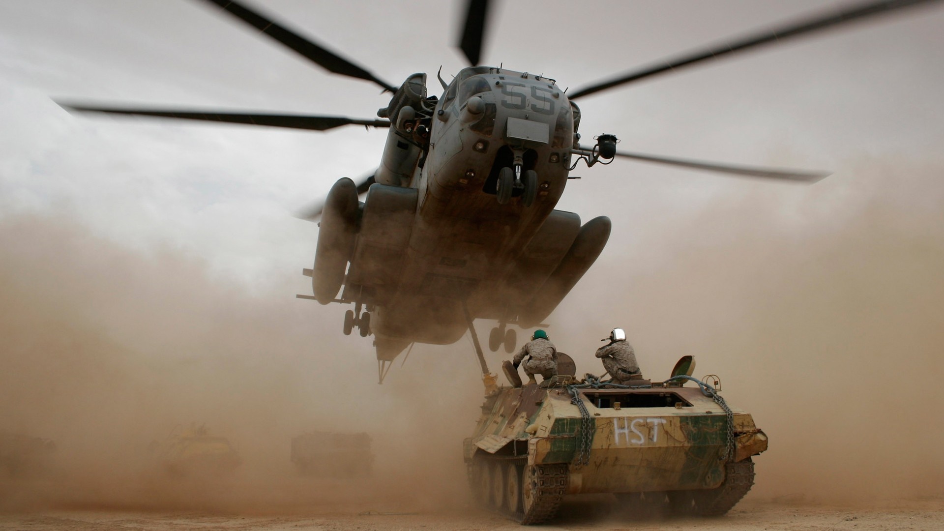 MH-53 Pave Low helicopter over armored vehicles HD Wallpaper