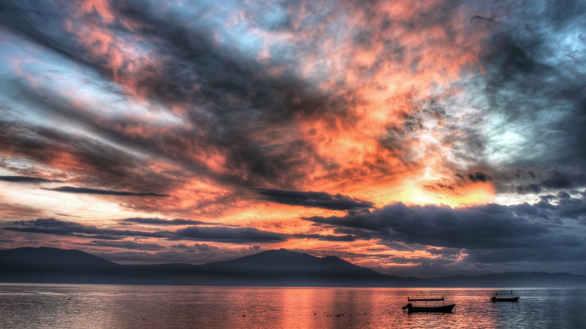 Dramatic Sunset Over Calm Sea with Boats HD Wallpaper