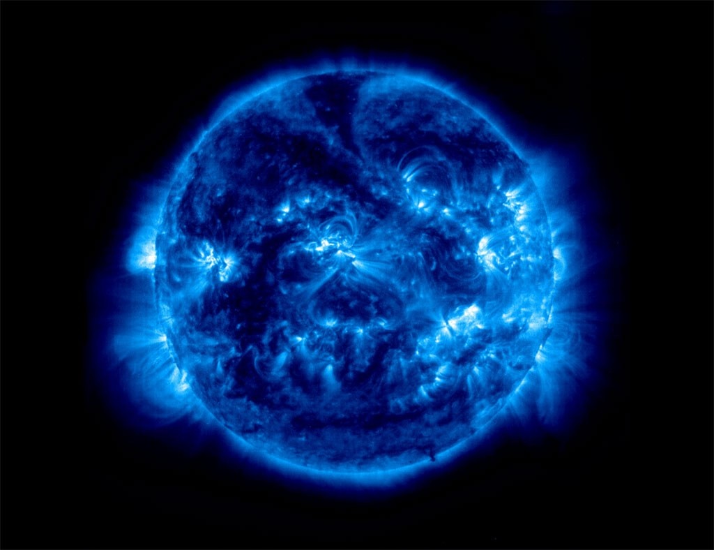 The Sun in blue tones with solar flares HD Wallpaper