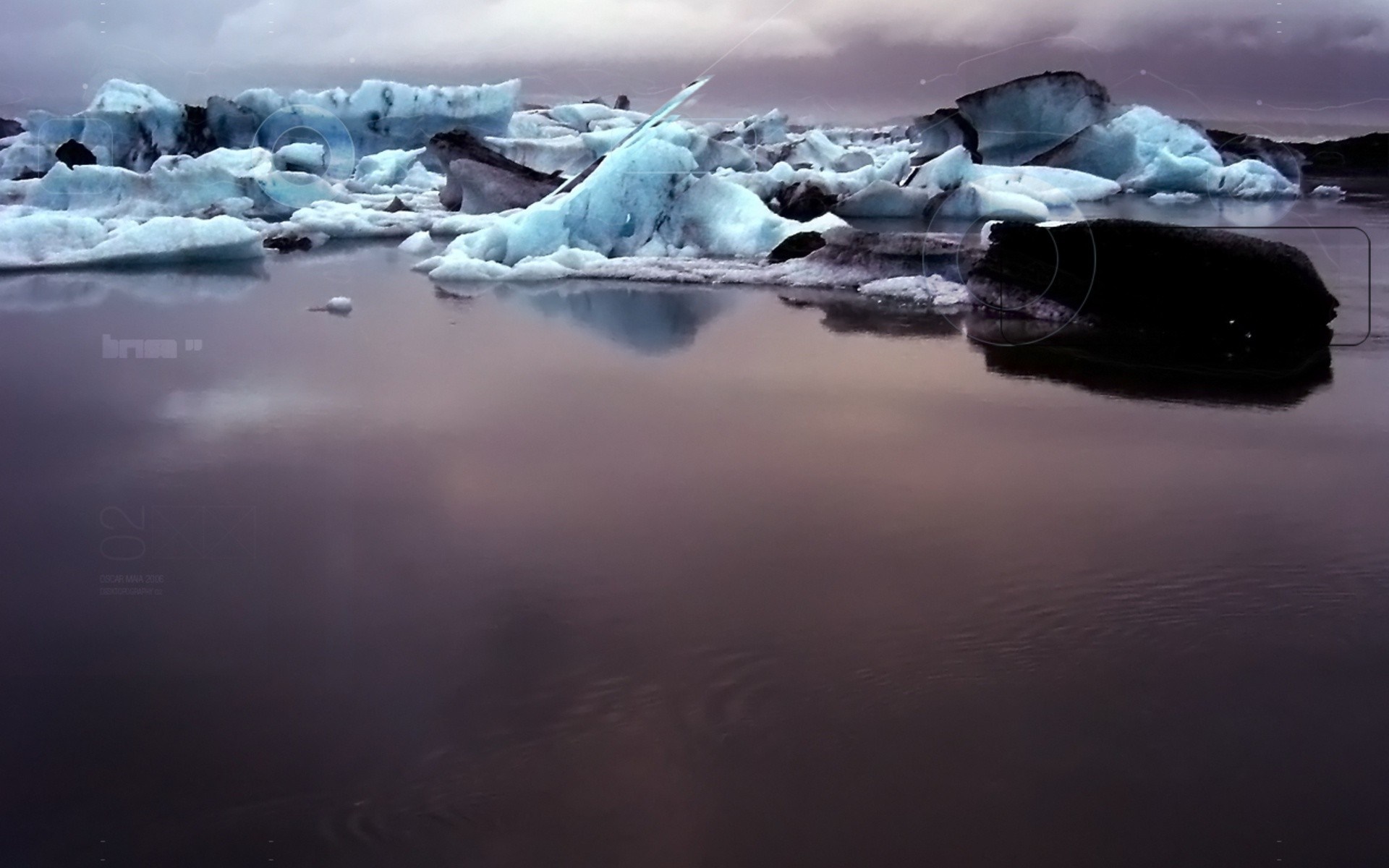Icebergs floating in dark water with reflections HD Wallpaper