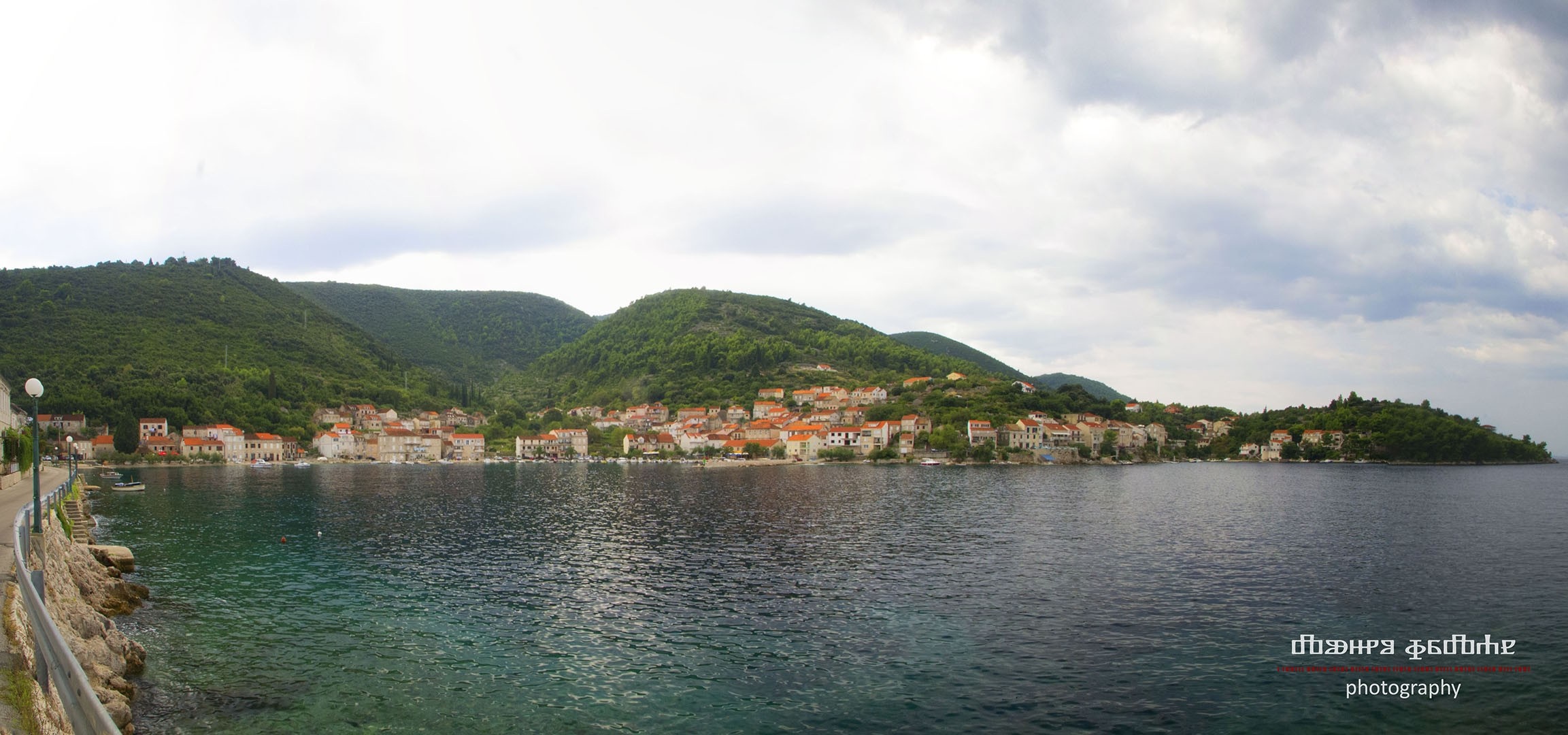 Coastal town in Croatia with green hills and blue water HD Wallpaper