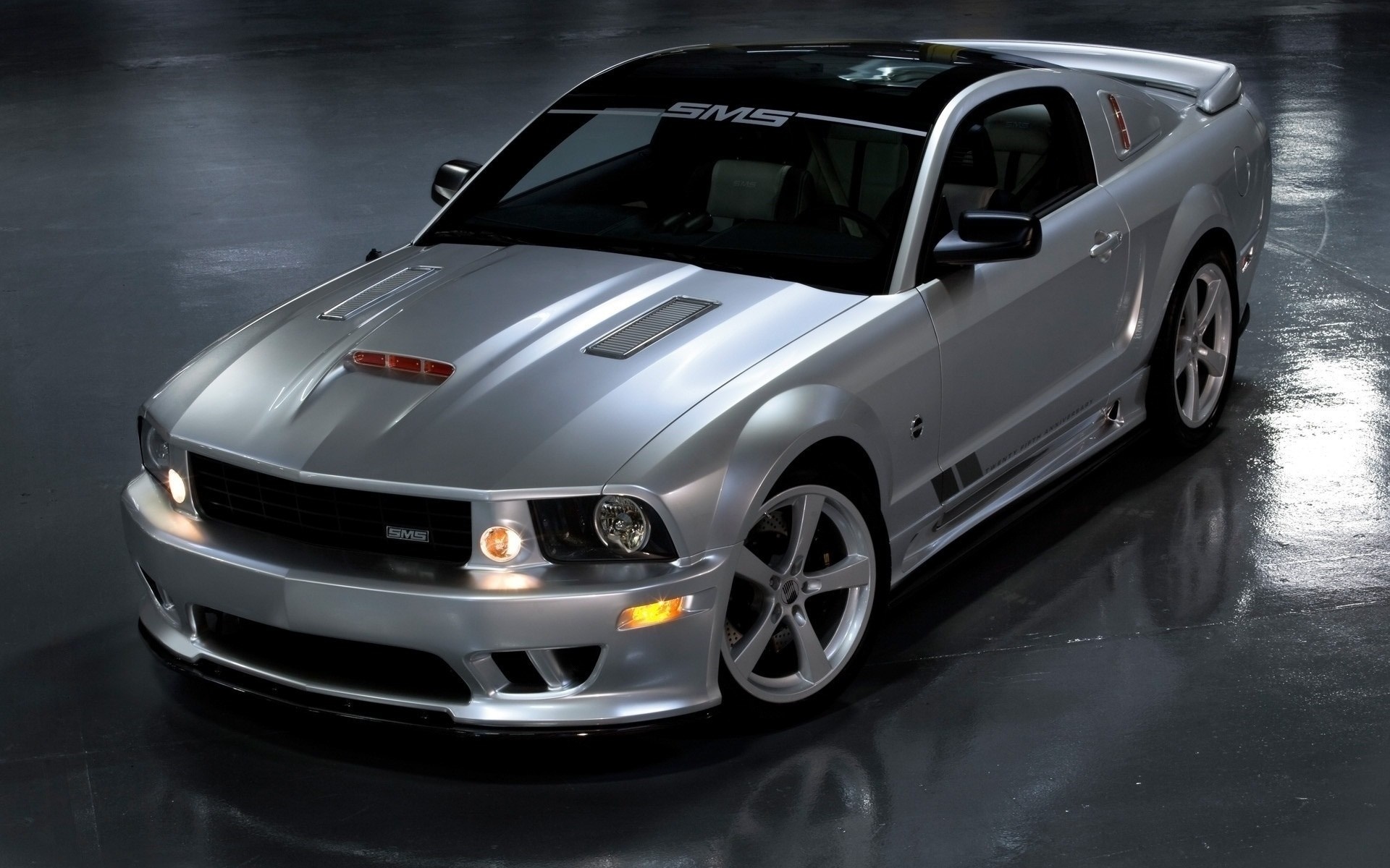 Silver SMS Ford Mustang parked on a wet floor HD Wallpaper