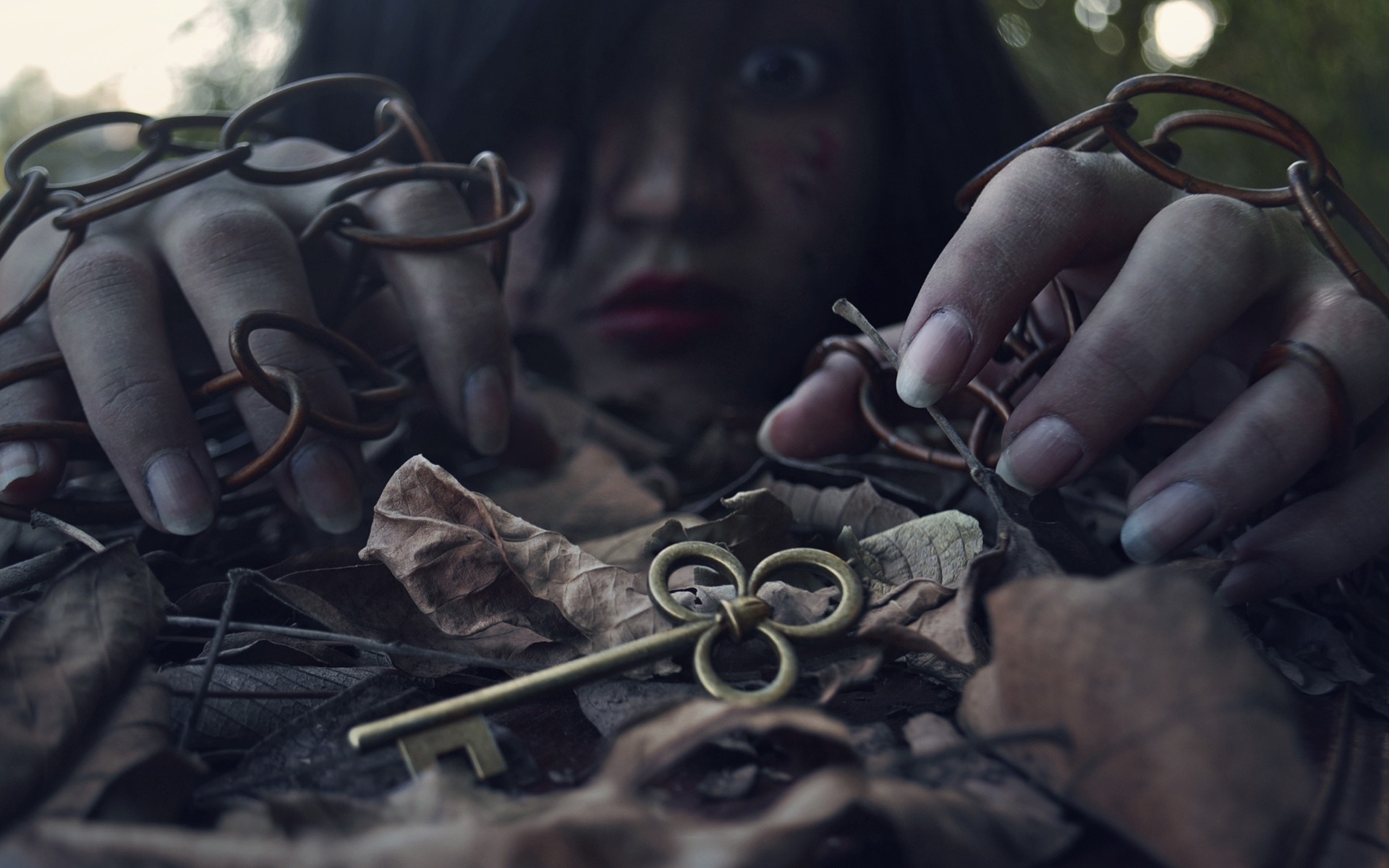 Woman with chains and key in leaves HD Wallpaper