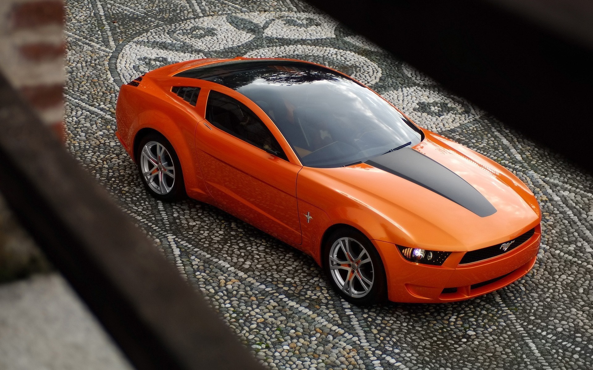 Orange Ford Mustang concept car on cobblestone HD Wallpaper