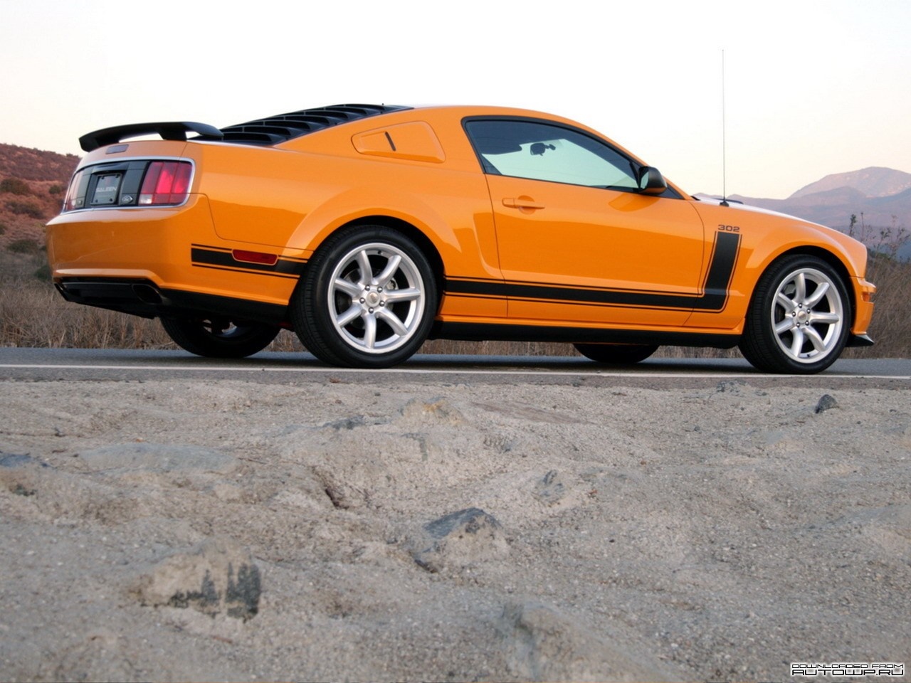 Orange Ford Mustang Boss 302 parked on a road HD Wallpaper
