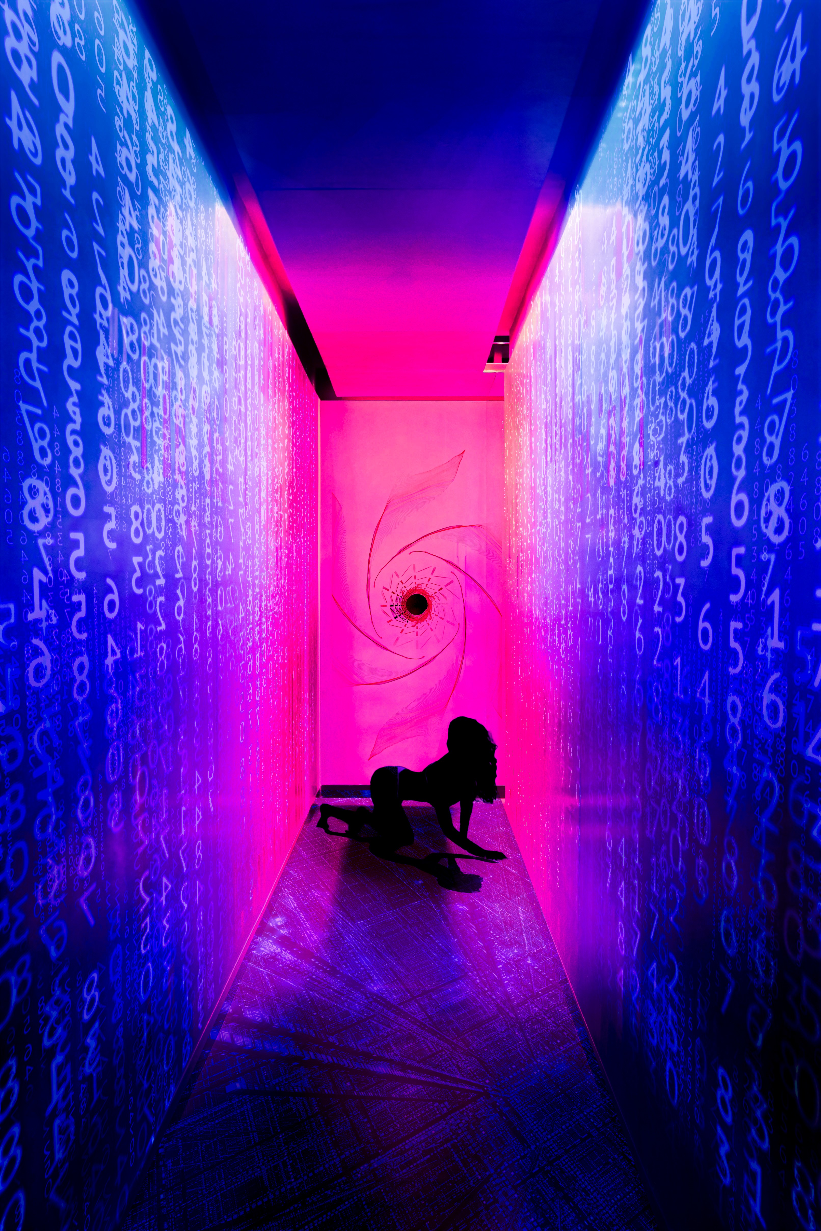 Silhouette of a woman in a neon hallway with digital code HD Phone Wallpaper