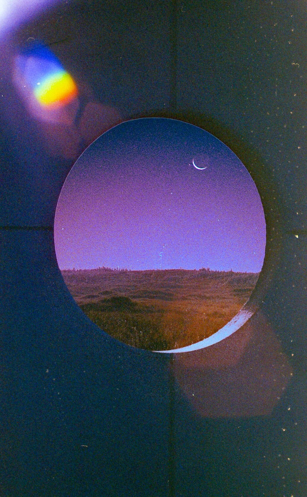Circular window view of a moonlit landscape HD Phone Wallpaper