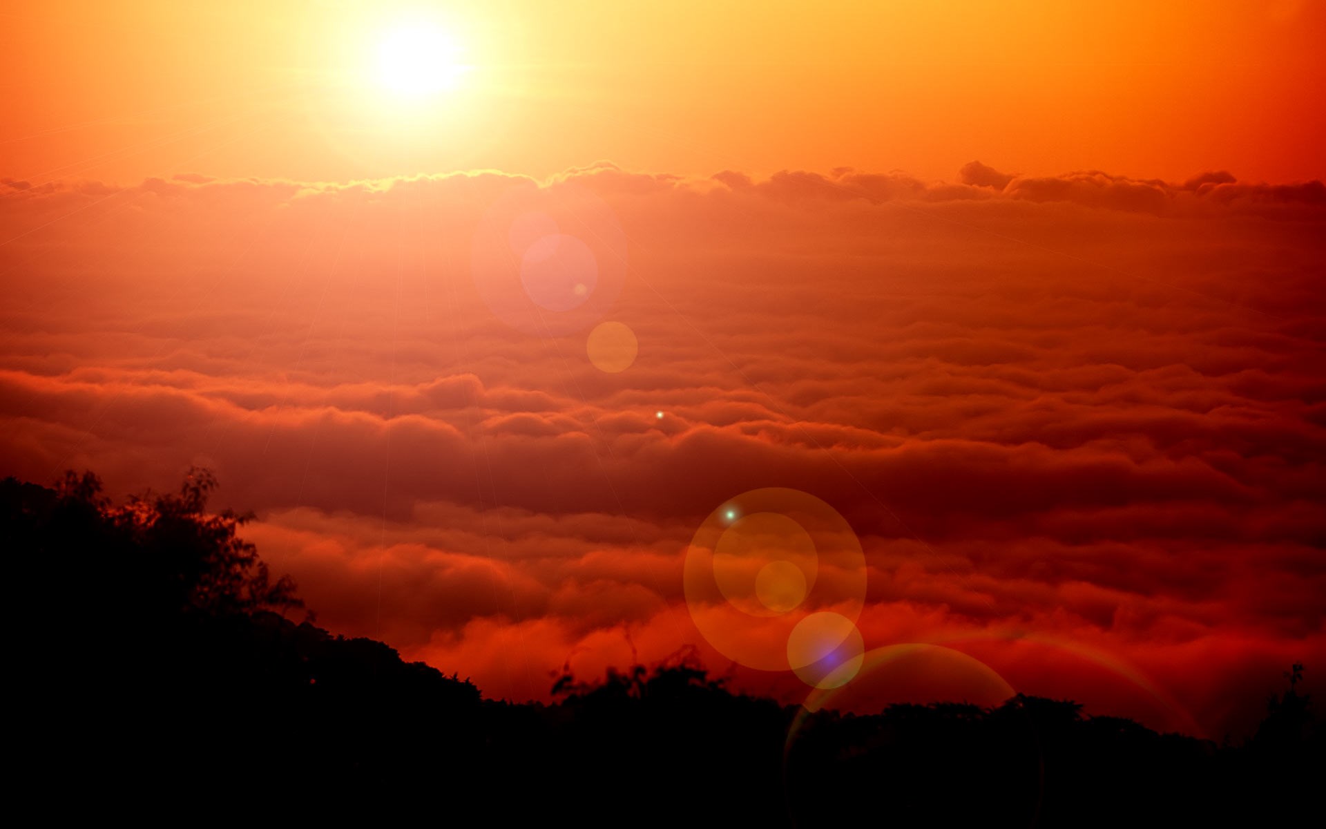 Sunset over clouds with lens flare HD Wallpaper