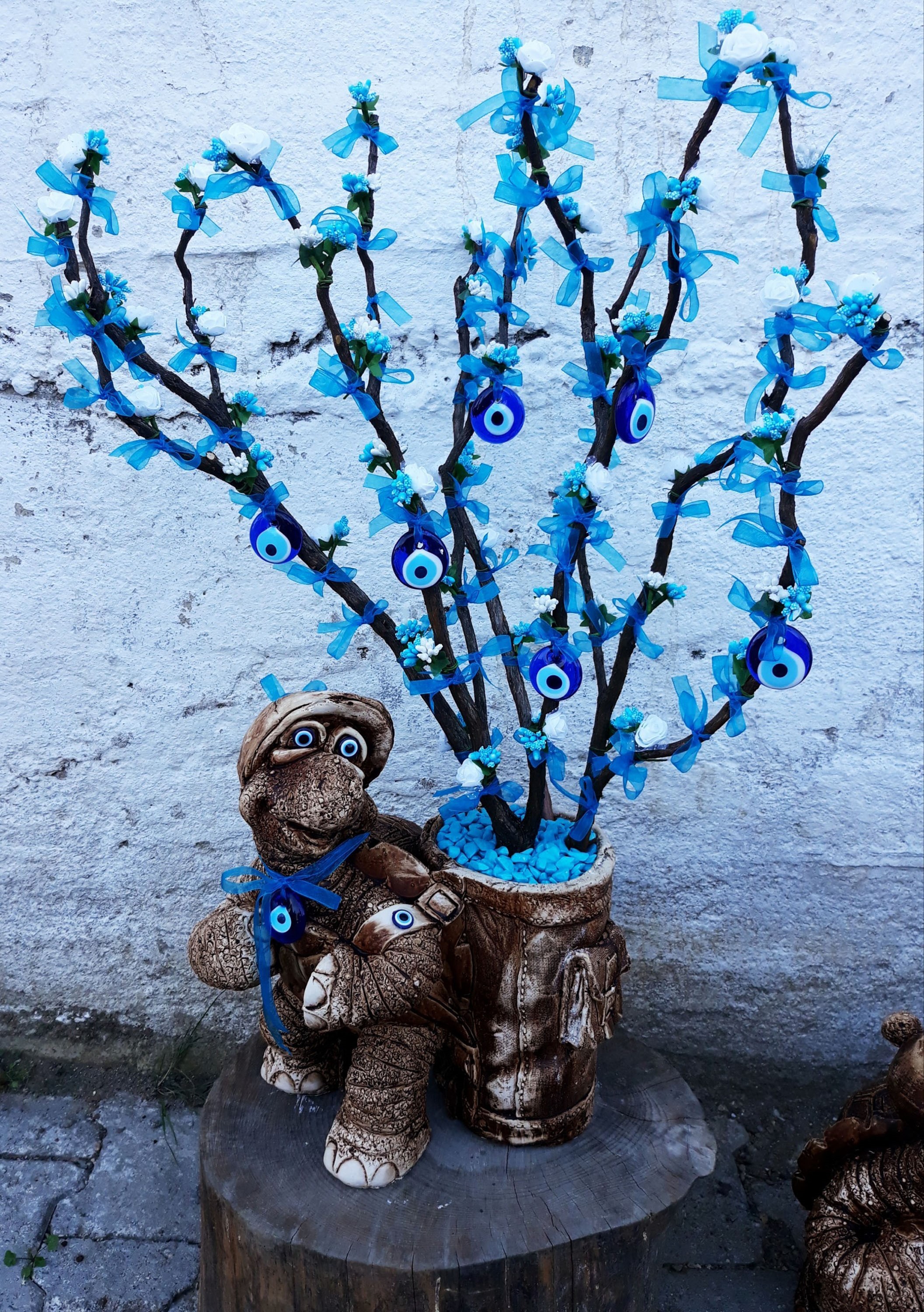 Decorative tree with evil eye charms and turtle figurine HD Phone Wallpaper