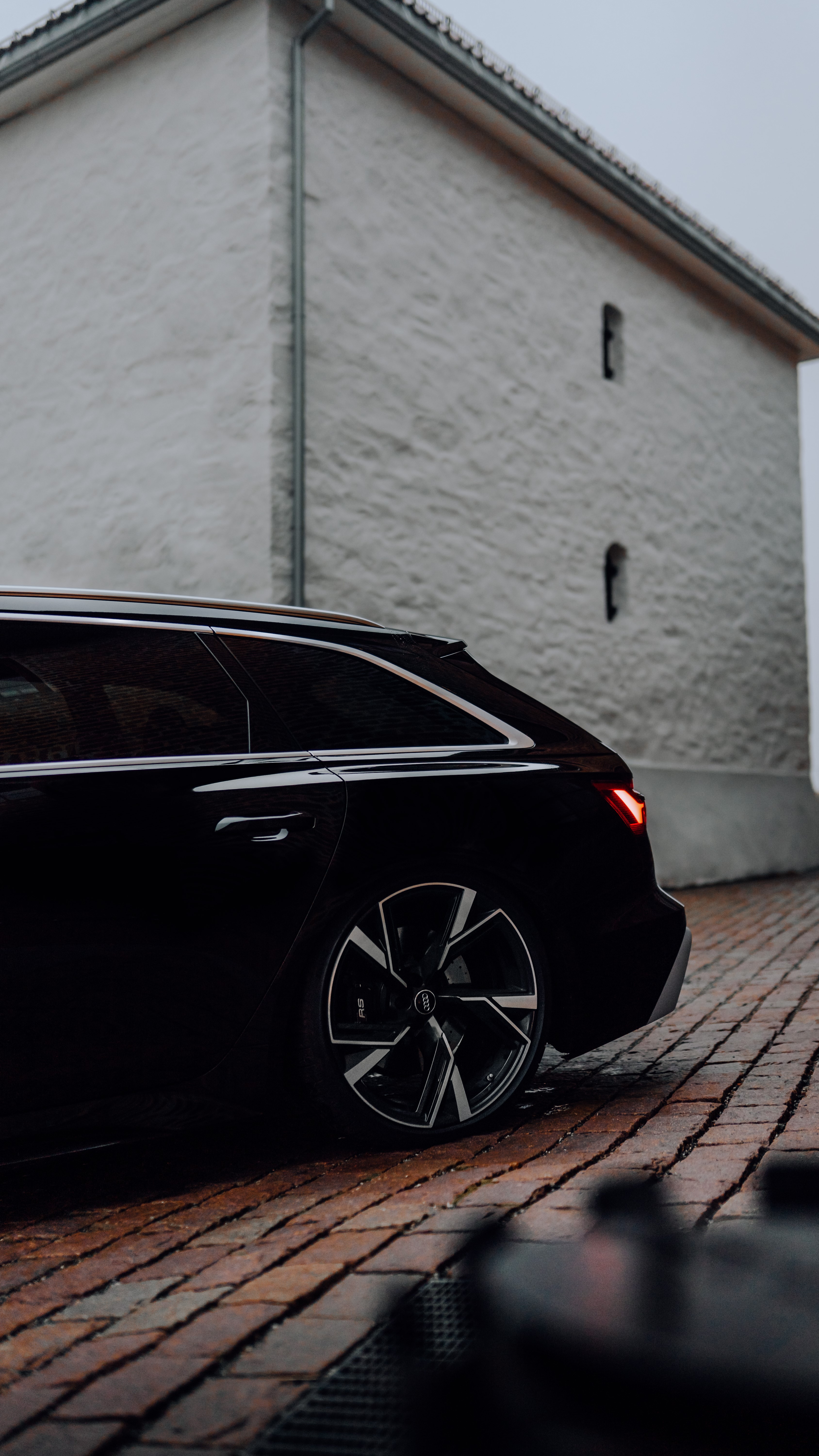 Black Audi RS6 Avant parked on cobblestone street HD Phone Wallpaper