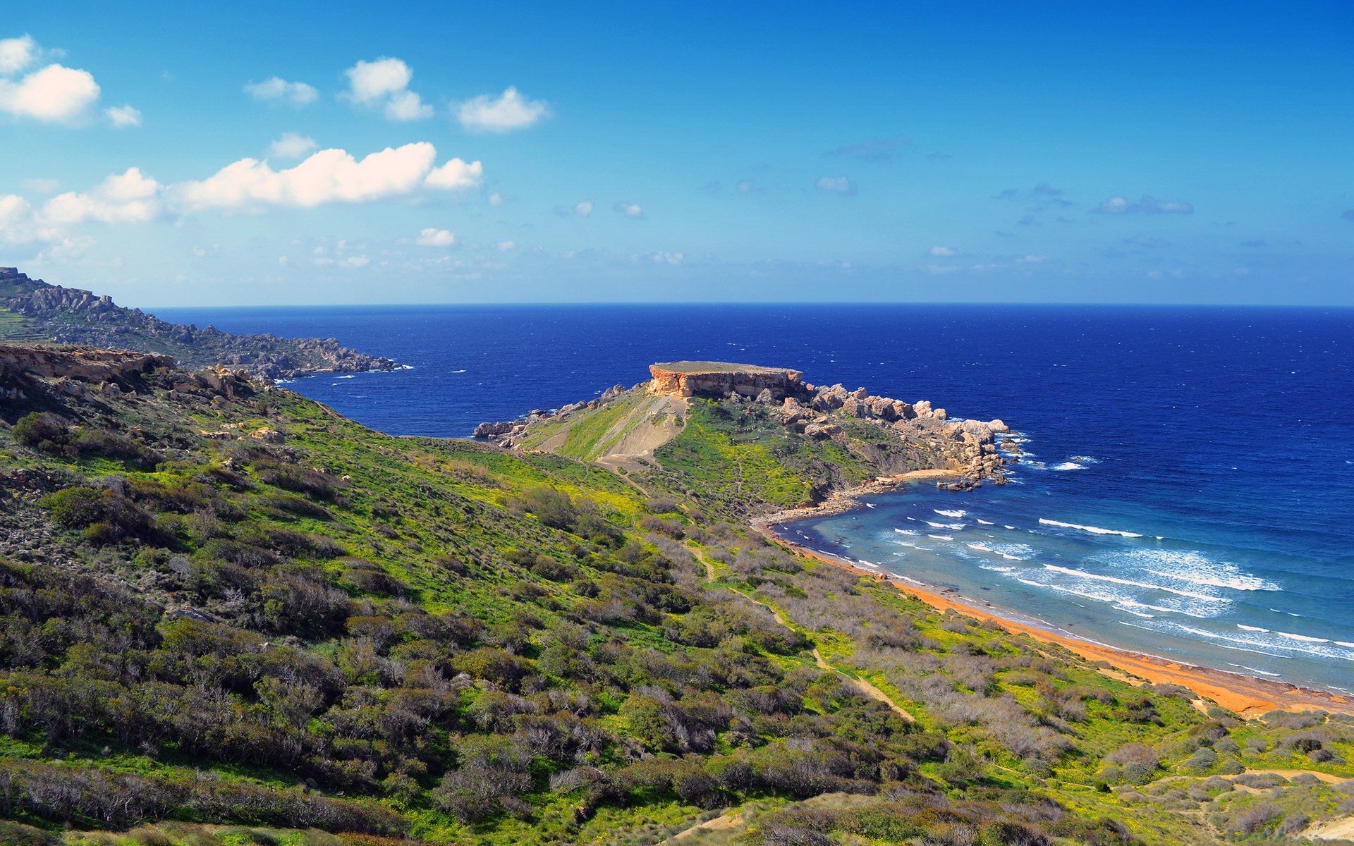 Coastal landscape with rocky cliffs and blue sea HD Wallpaper