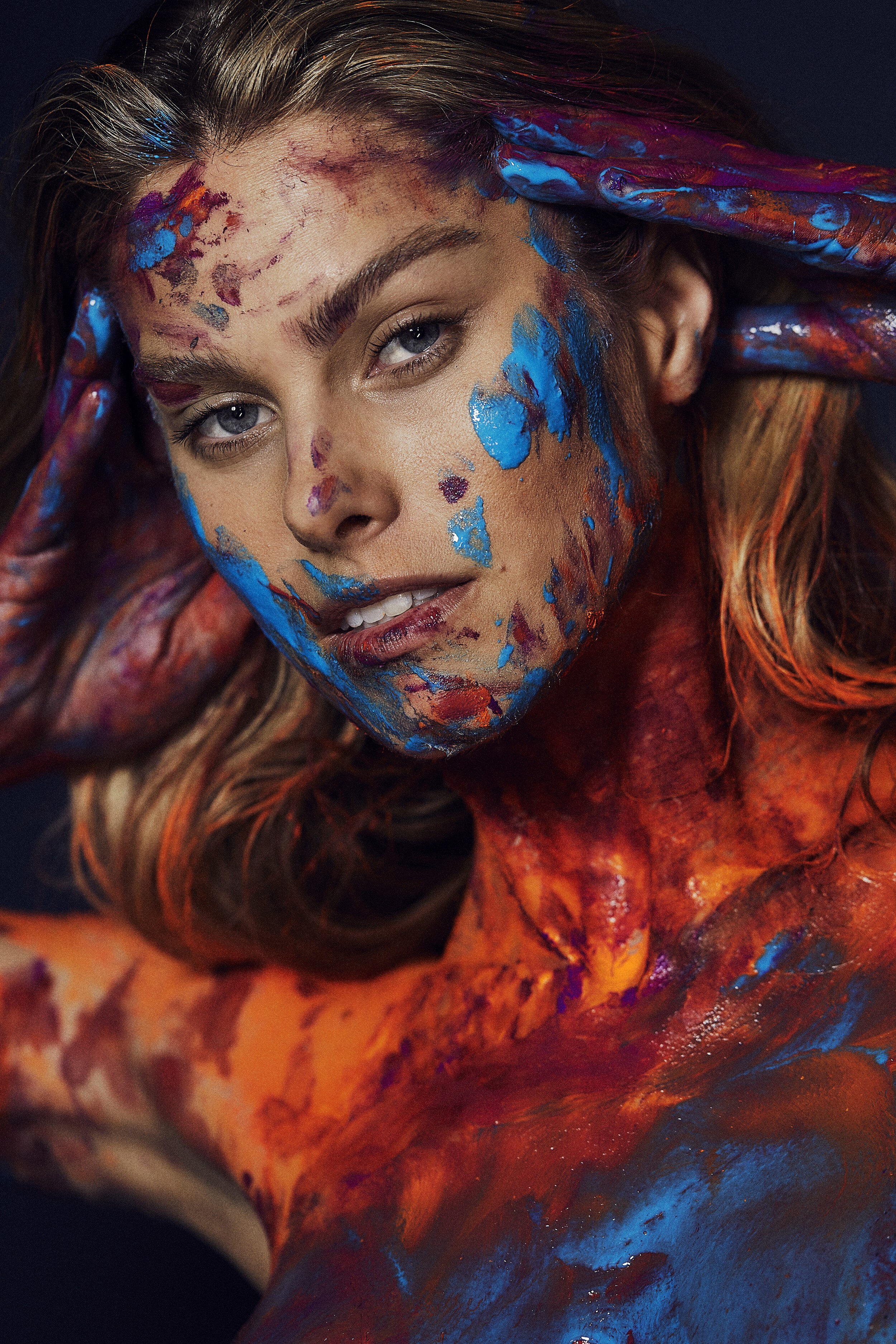 Woman covered in blue and orange paint HD Phone Wallpaper