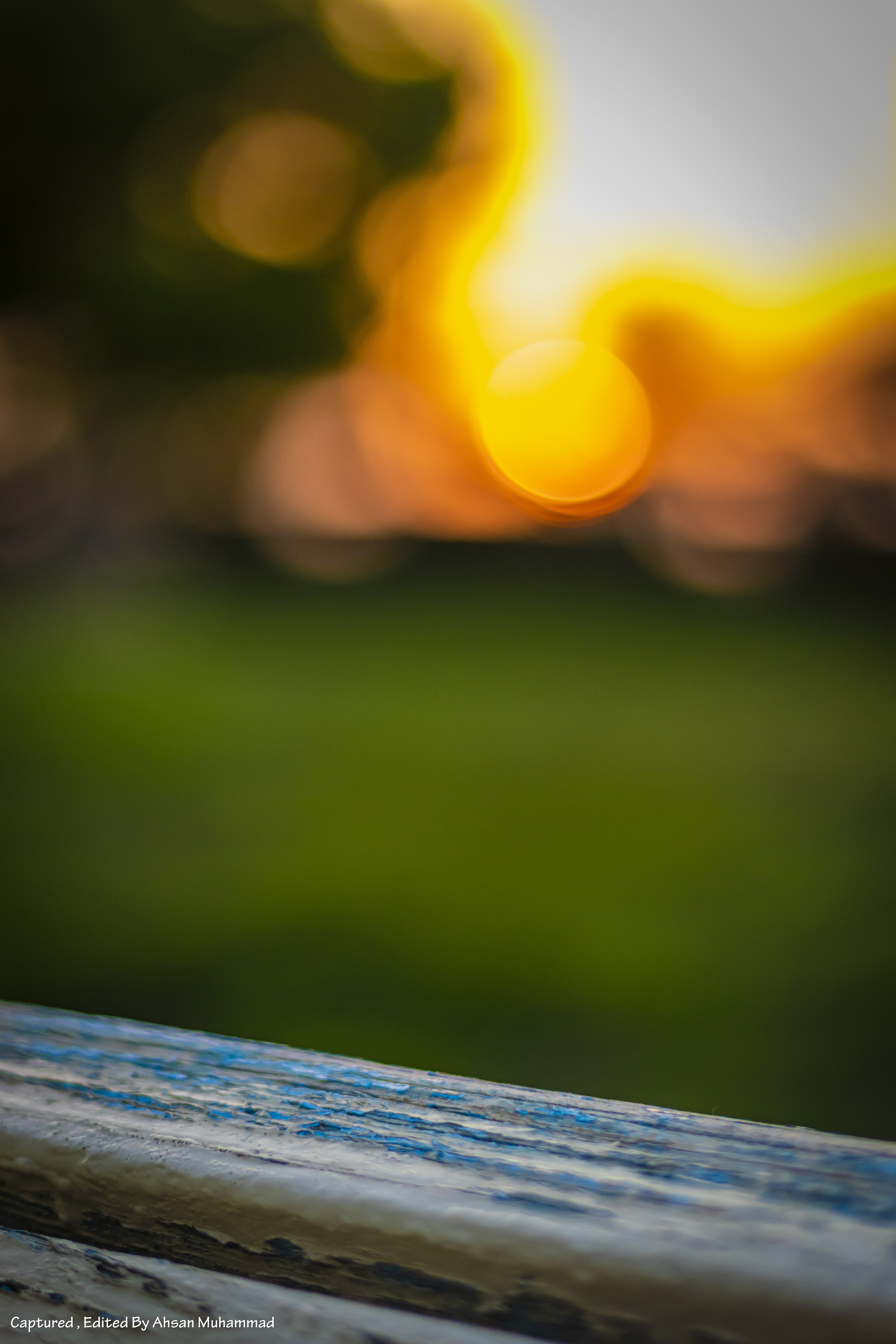 Bokeh sunlight over a park bench and grass HD Phone Wallpaper