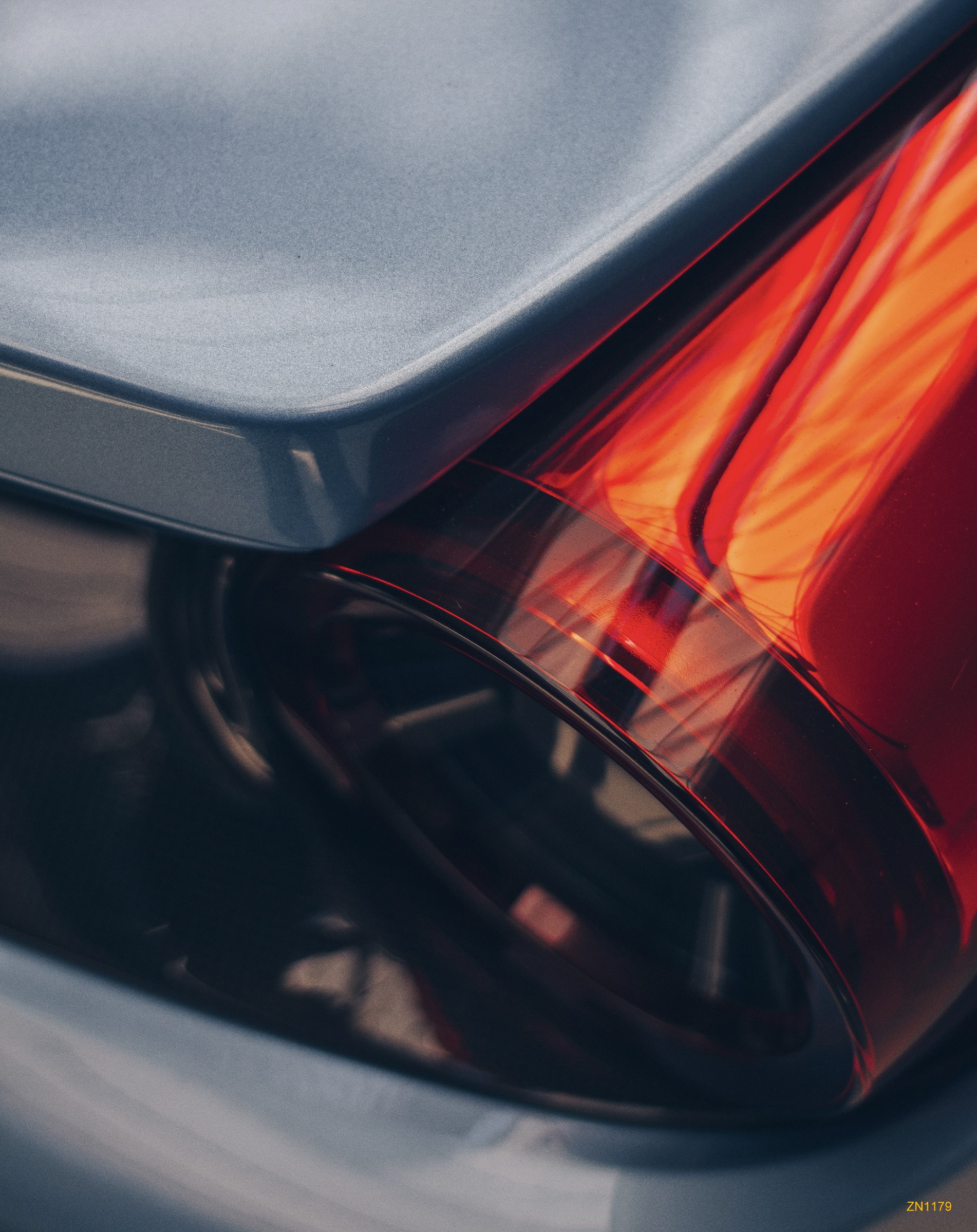 Close-up of a red Ferrari taillight HD Phone Wallpaper
