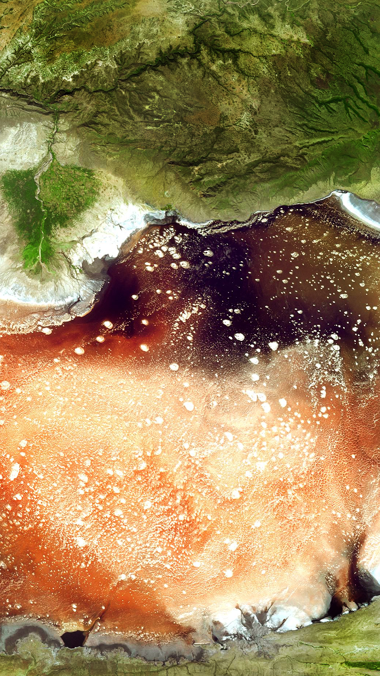 Aerial view of a salt lake with surrounding land HD Phone Wallpaper