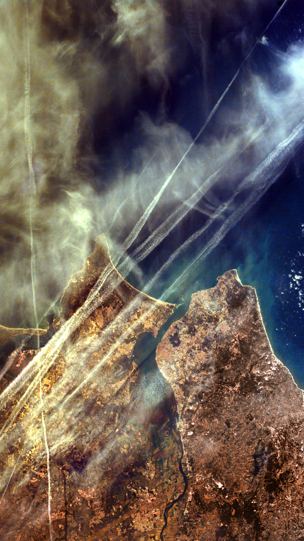 Satellite view of landmasses and clouds with contrails HD Phone Wallpaper
