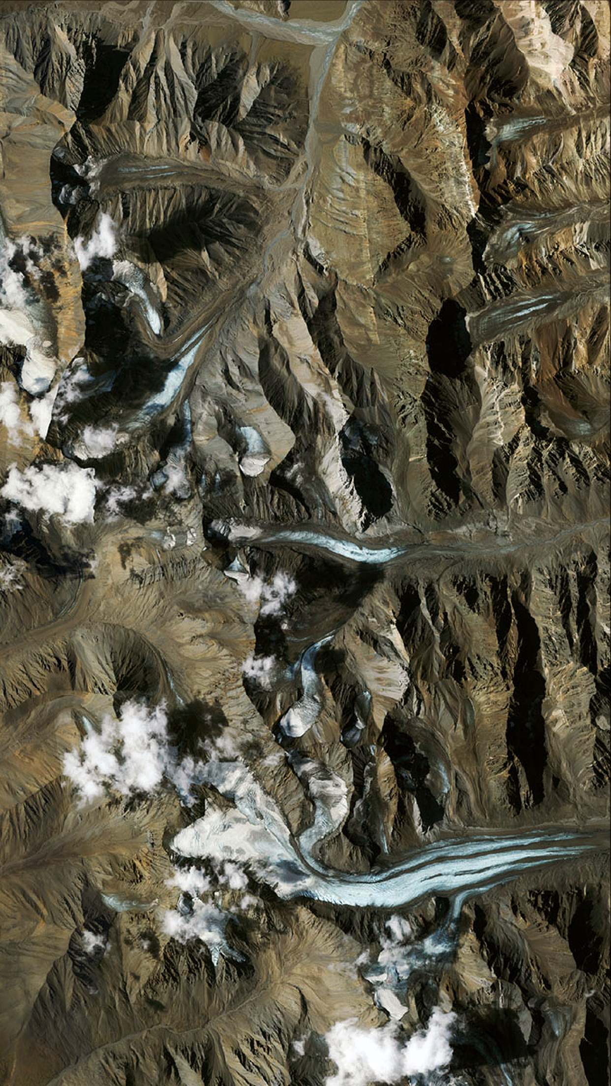 Aerial view of a mountainous landscape with glaciers HD Phone Wallpaper