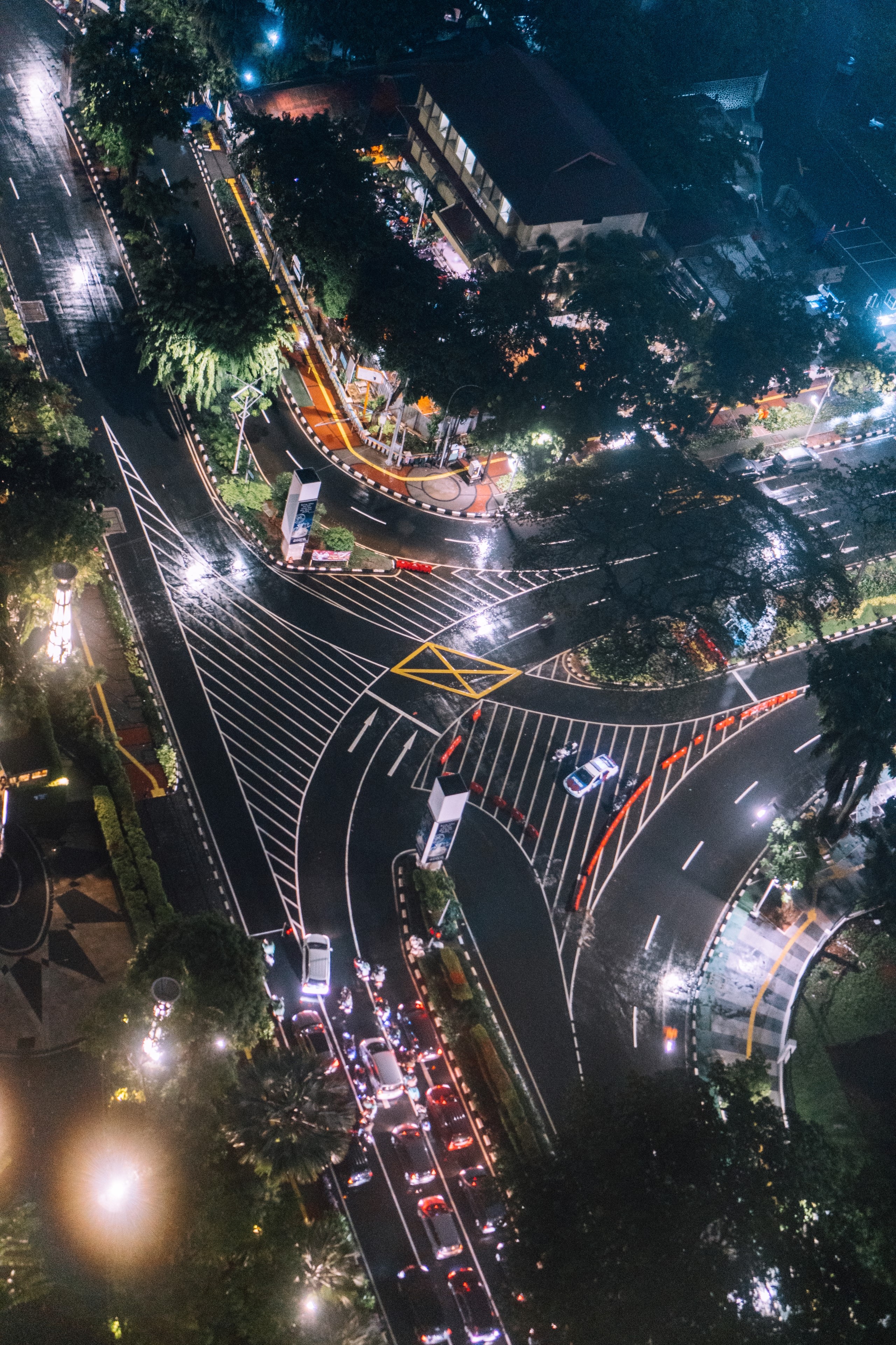 Aerial view of a busy intersection at night in Jakarta HD Phone Wallpaper