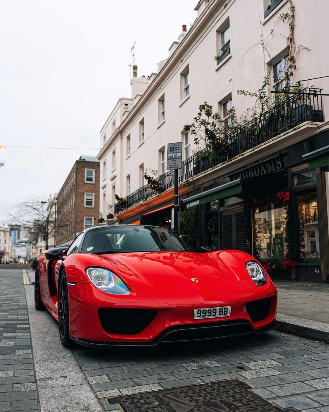Red Porsche 918 Spyder parked on a London street HD Phone Wallpaper