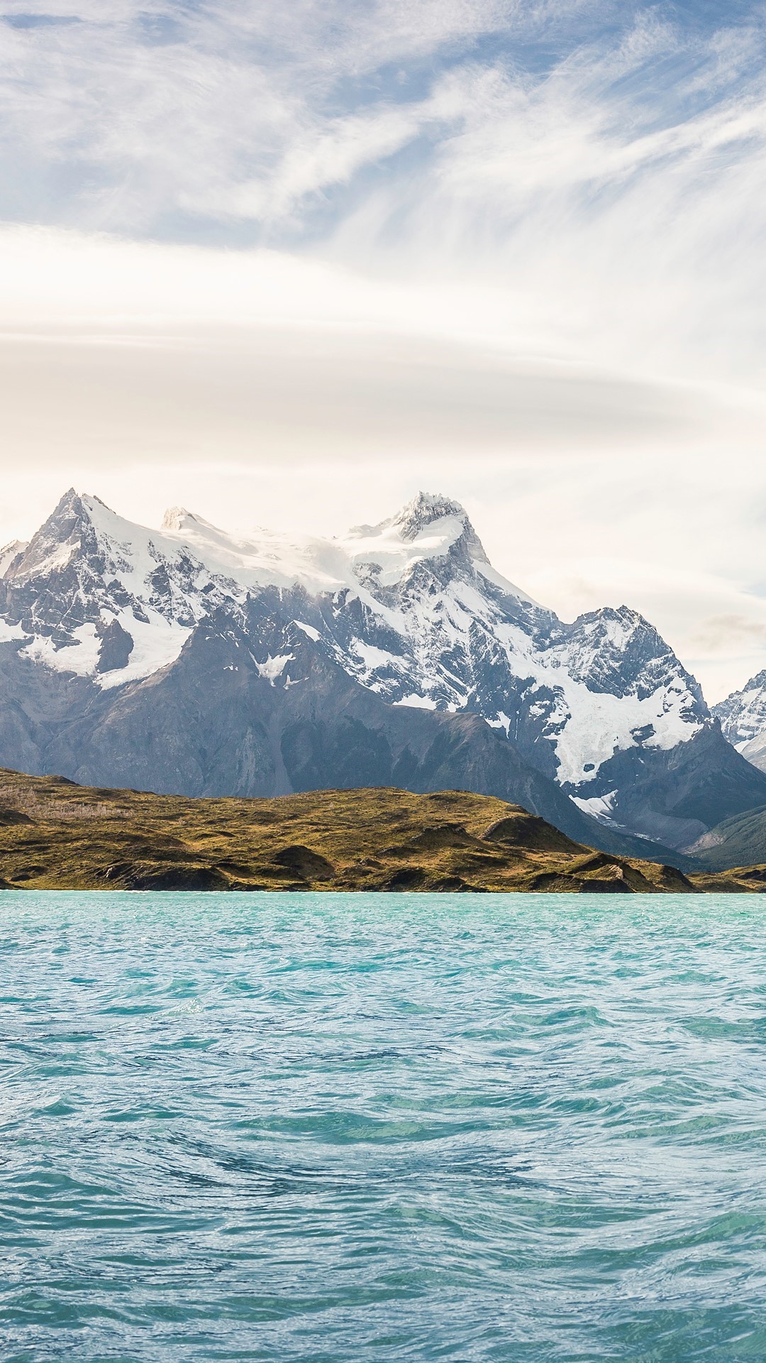 Snow-capped mountains over a turquoise lake HD Phone Wallpaper