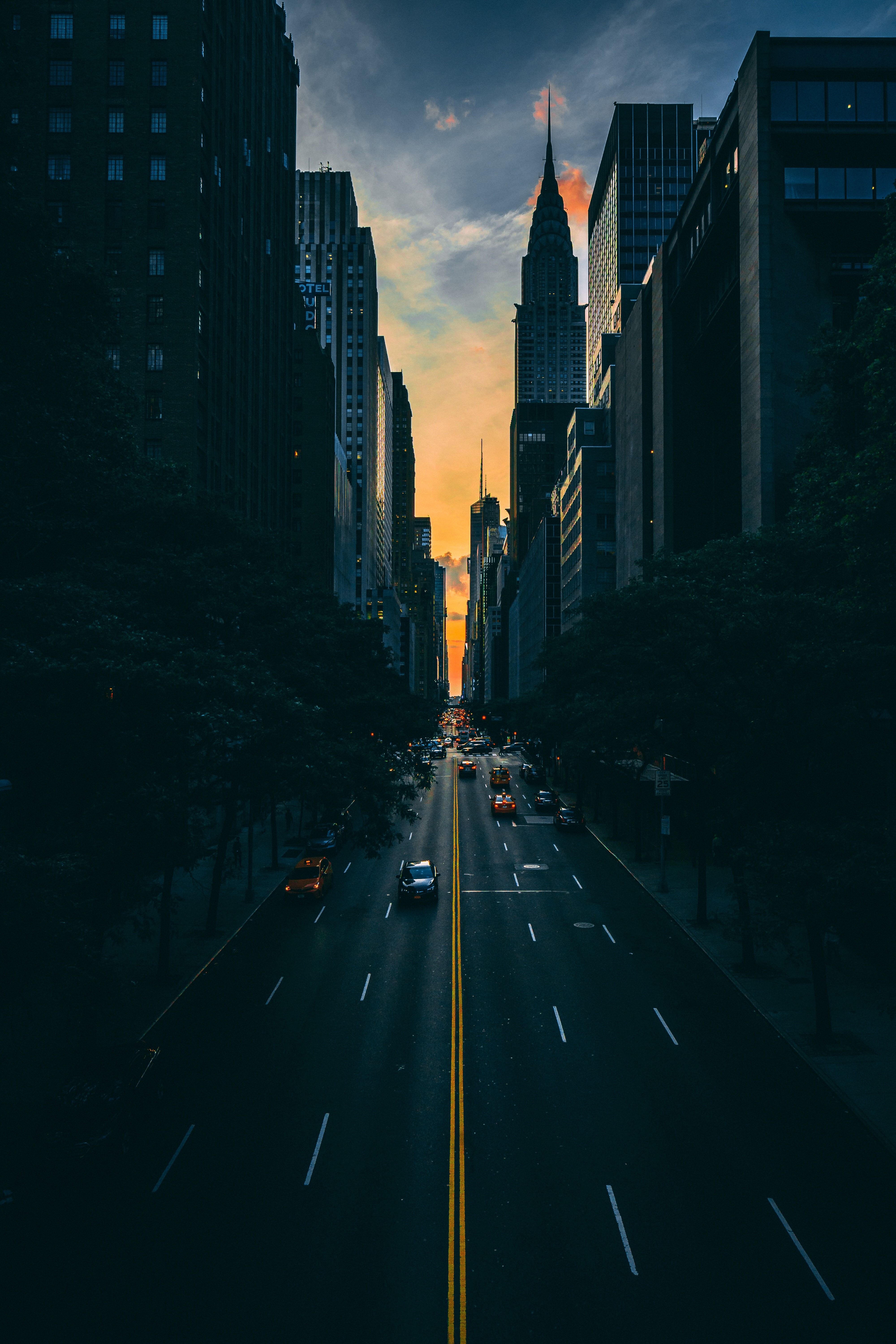 New York City street with Chrysler Building at sunset HD Phone Wallpaper