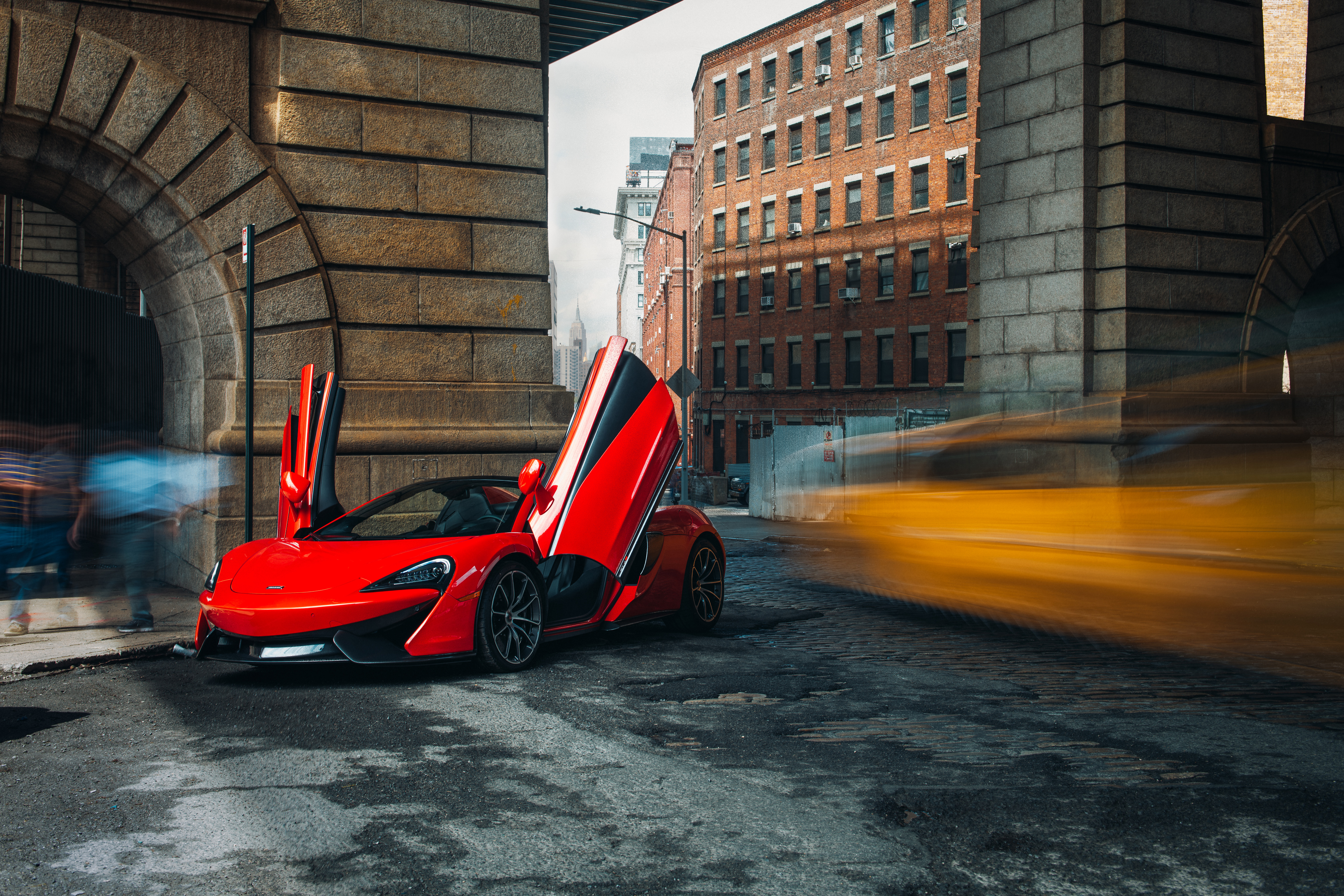 Red McLaren 570S Spider parked under a bridge in New York HD Wallpaper