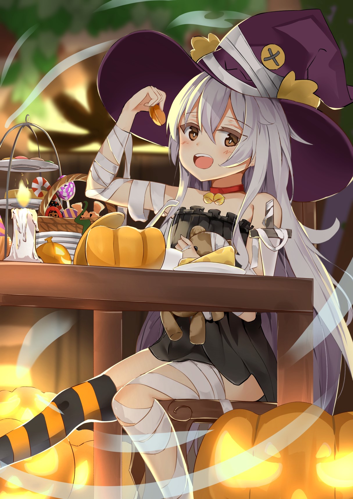 Witch girl in Halloween costume eating cake HD Phone Wallpaper