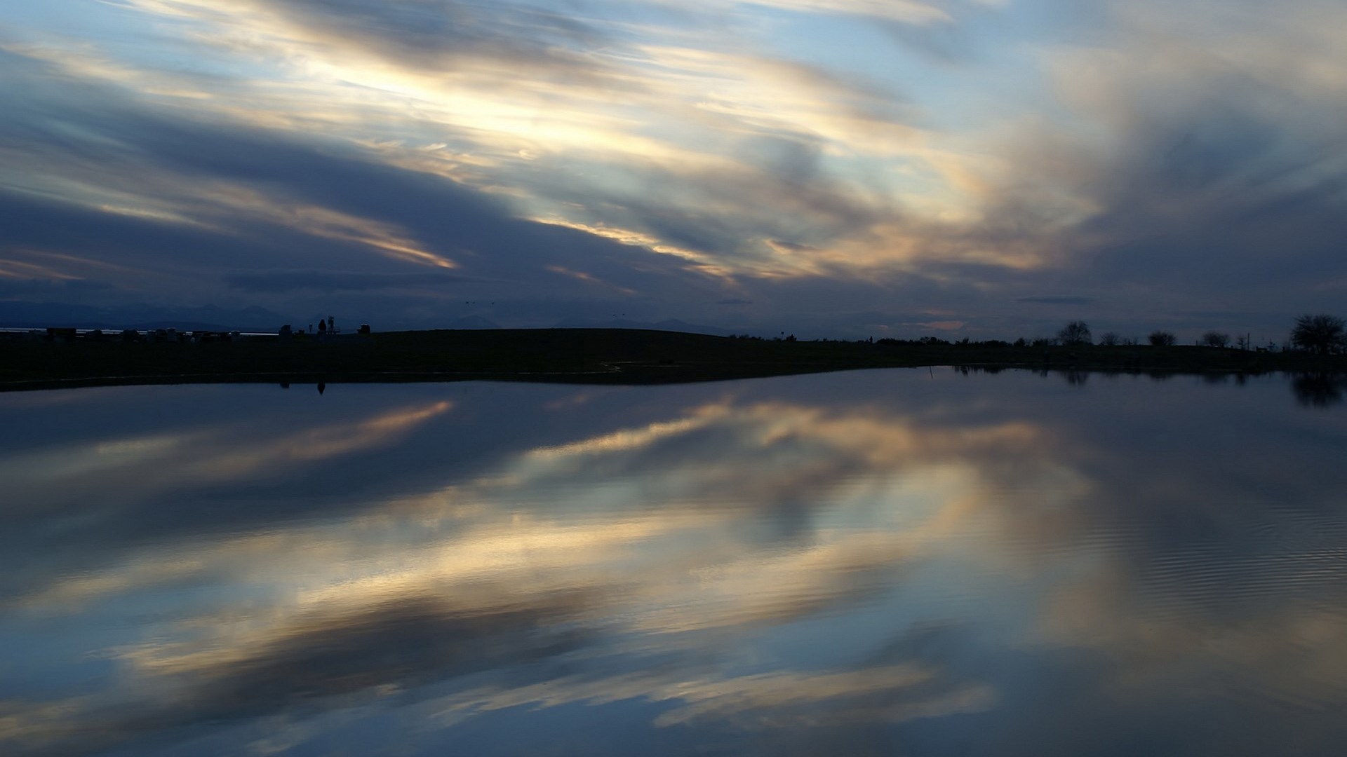 Sunset clouds reflected in a calm lake HD Wallpaper
