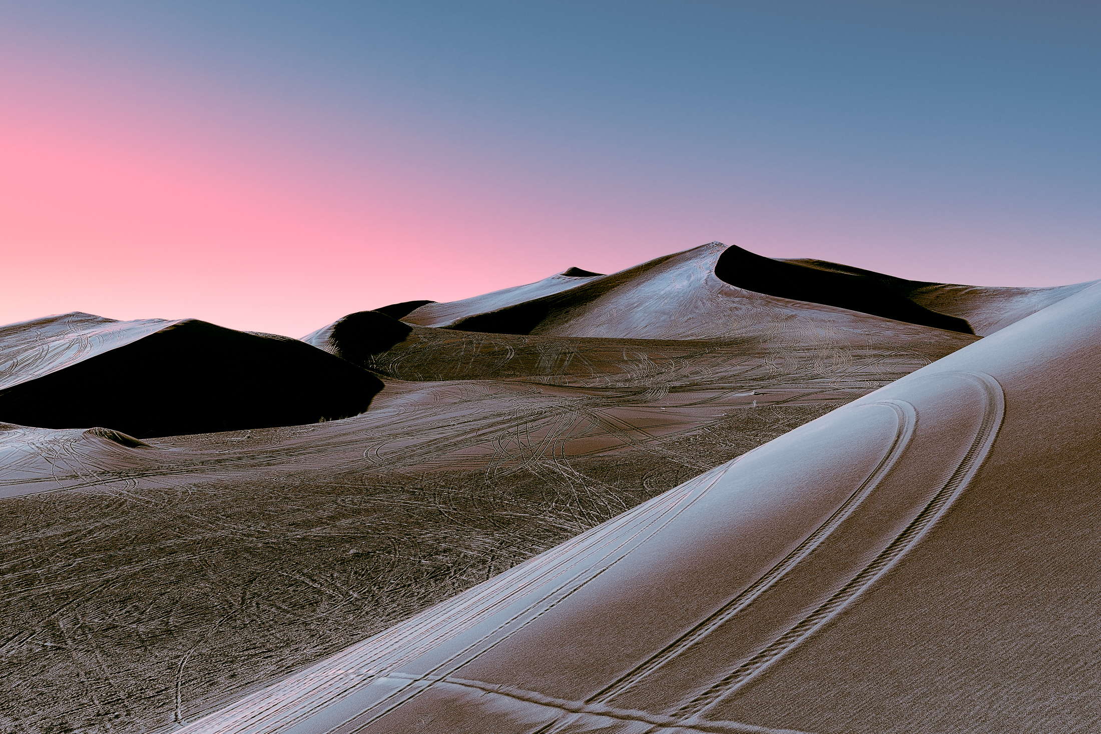Desert dunes at sunset with pink and blue sky HD Wallpaper