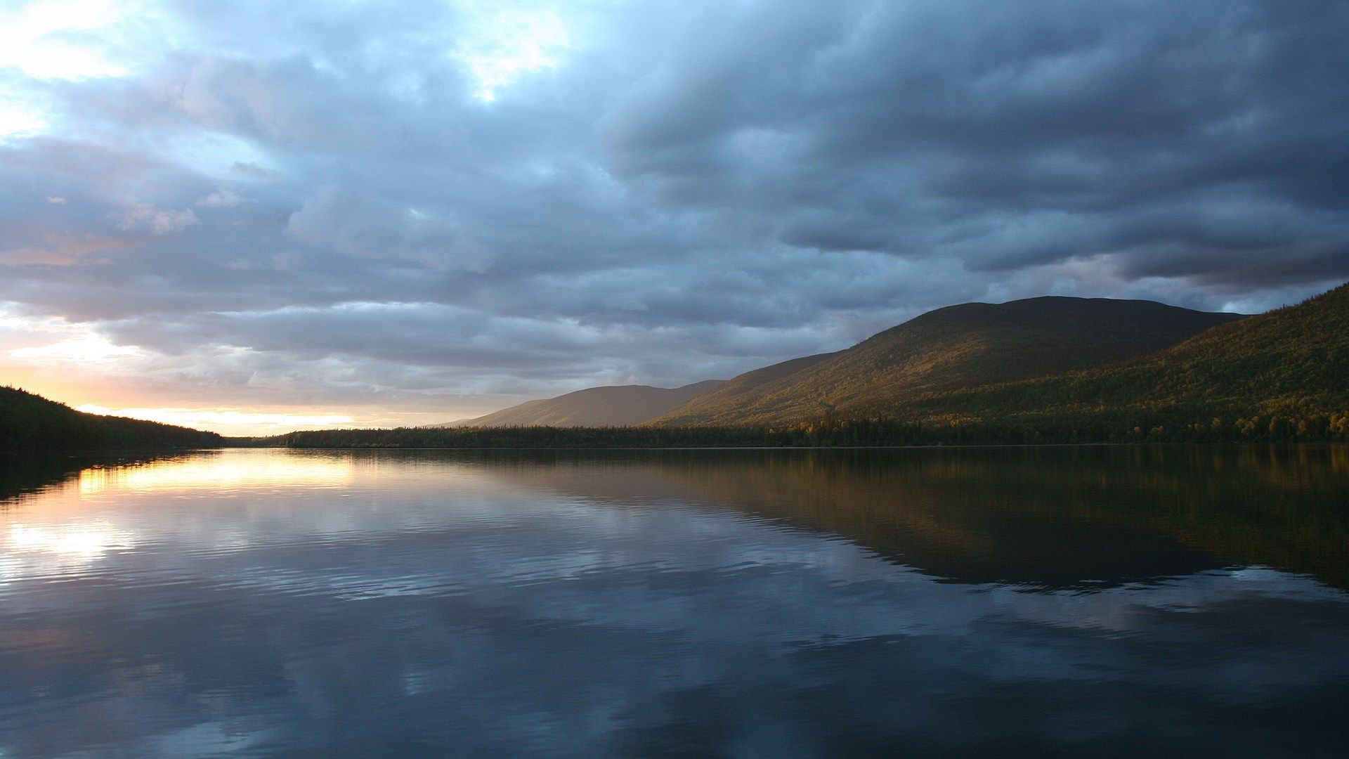 Lake and mountains at sunset with dramatic clouds HD Wallpaper