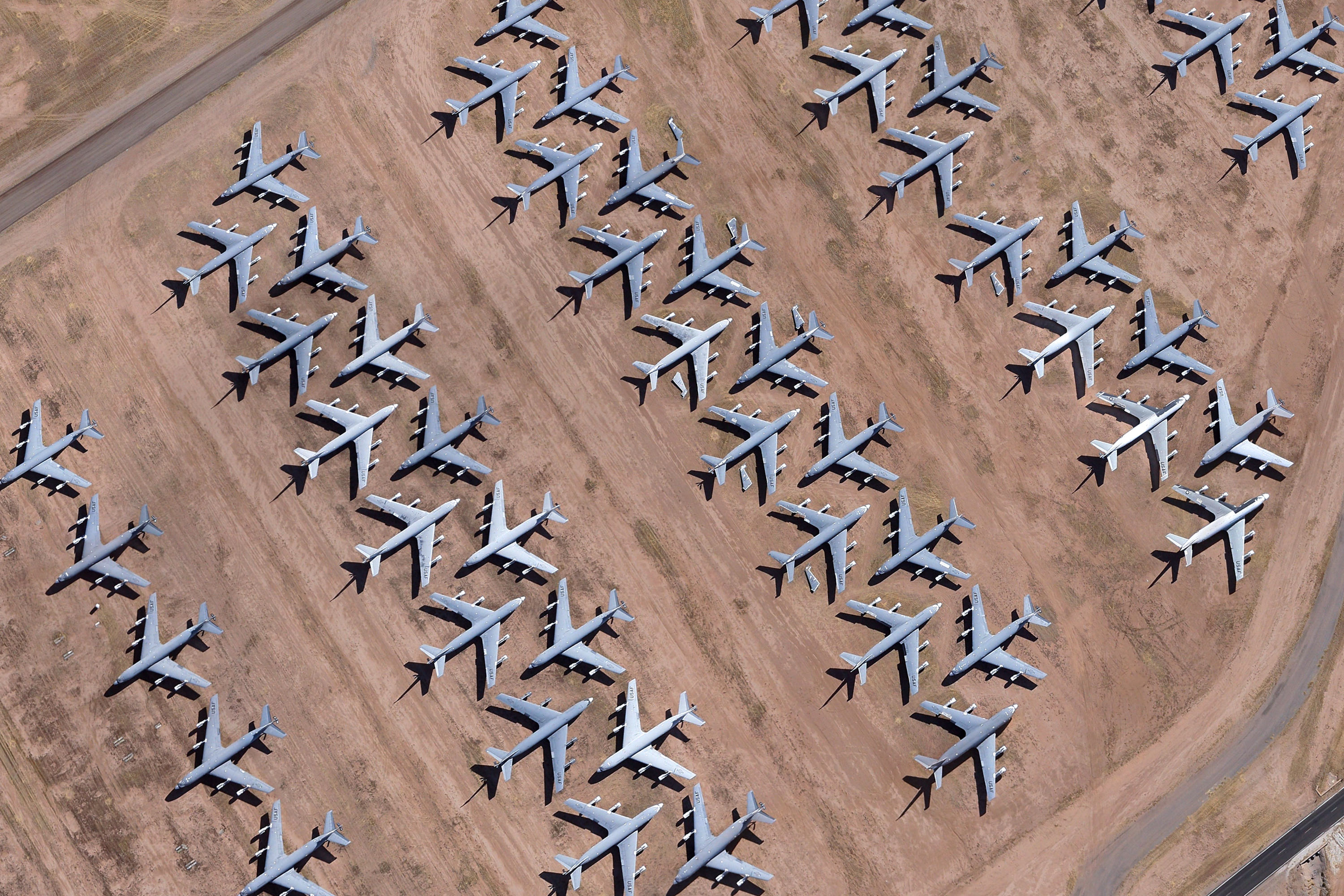 Aerial view of US Air Force planes in a boneyard HD Wallpaper