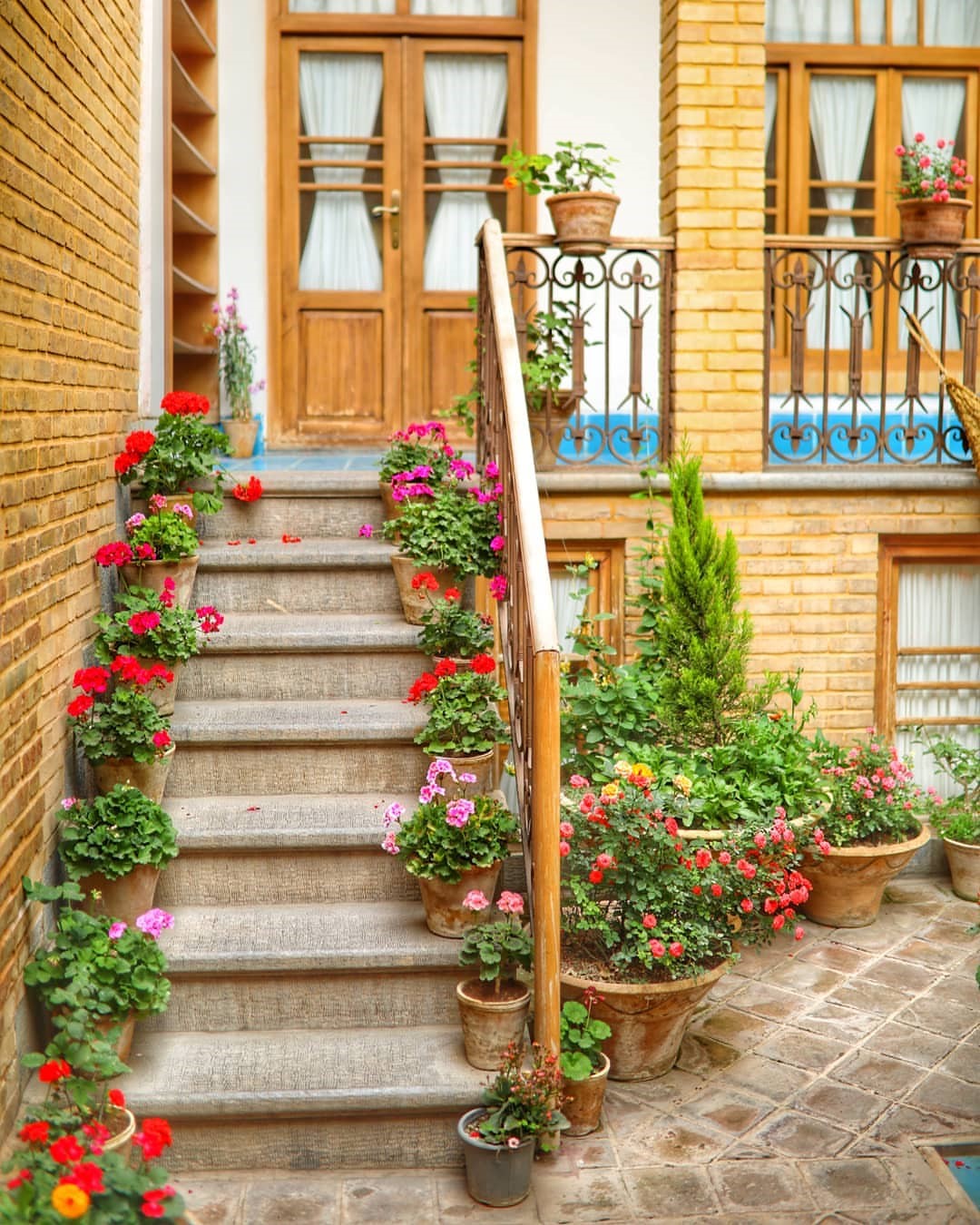 Stairs with flowerpots and brick wall in Iran HD Phone Wallpaper