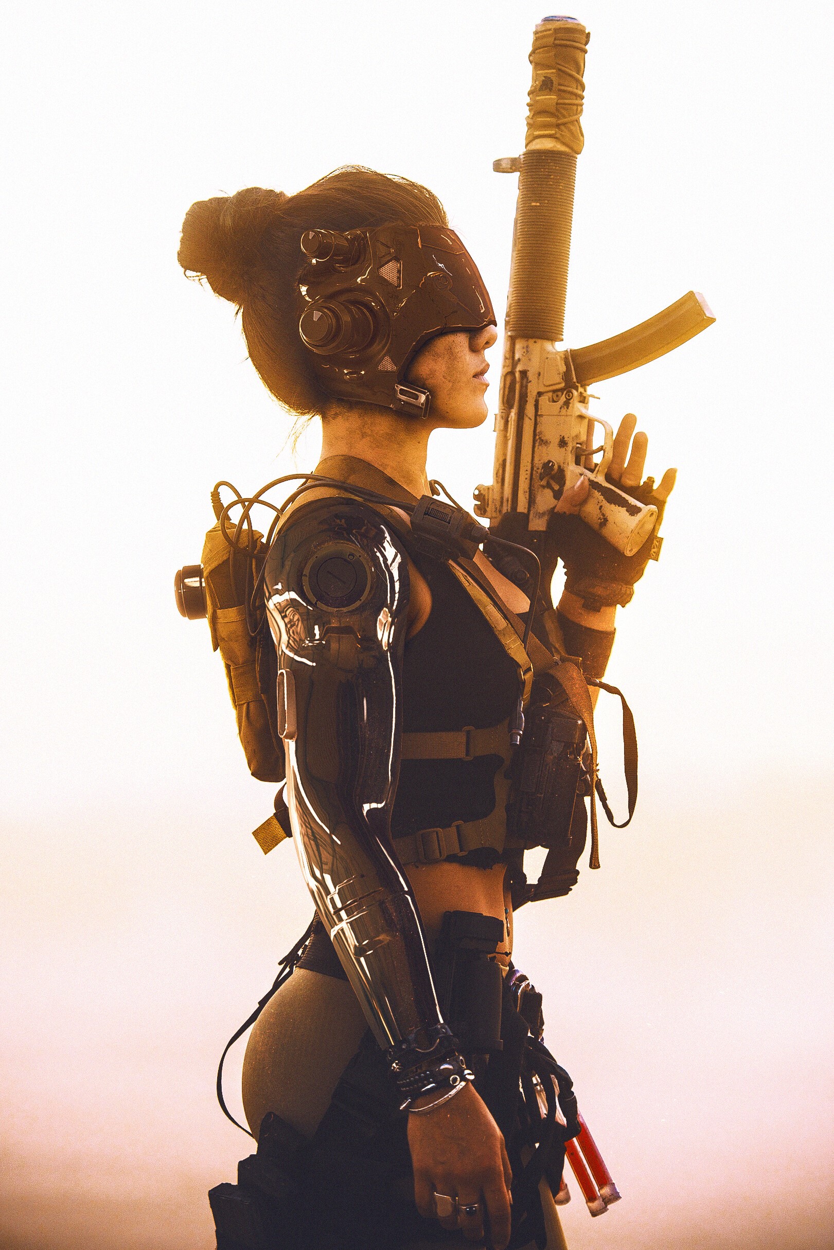 Woman with cybernetic arm holding a rifle HD Phone Wallpaper