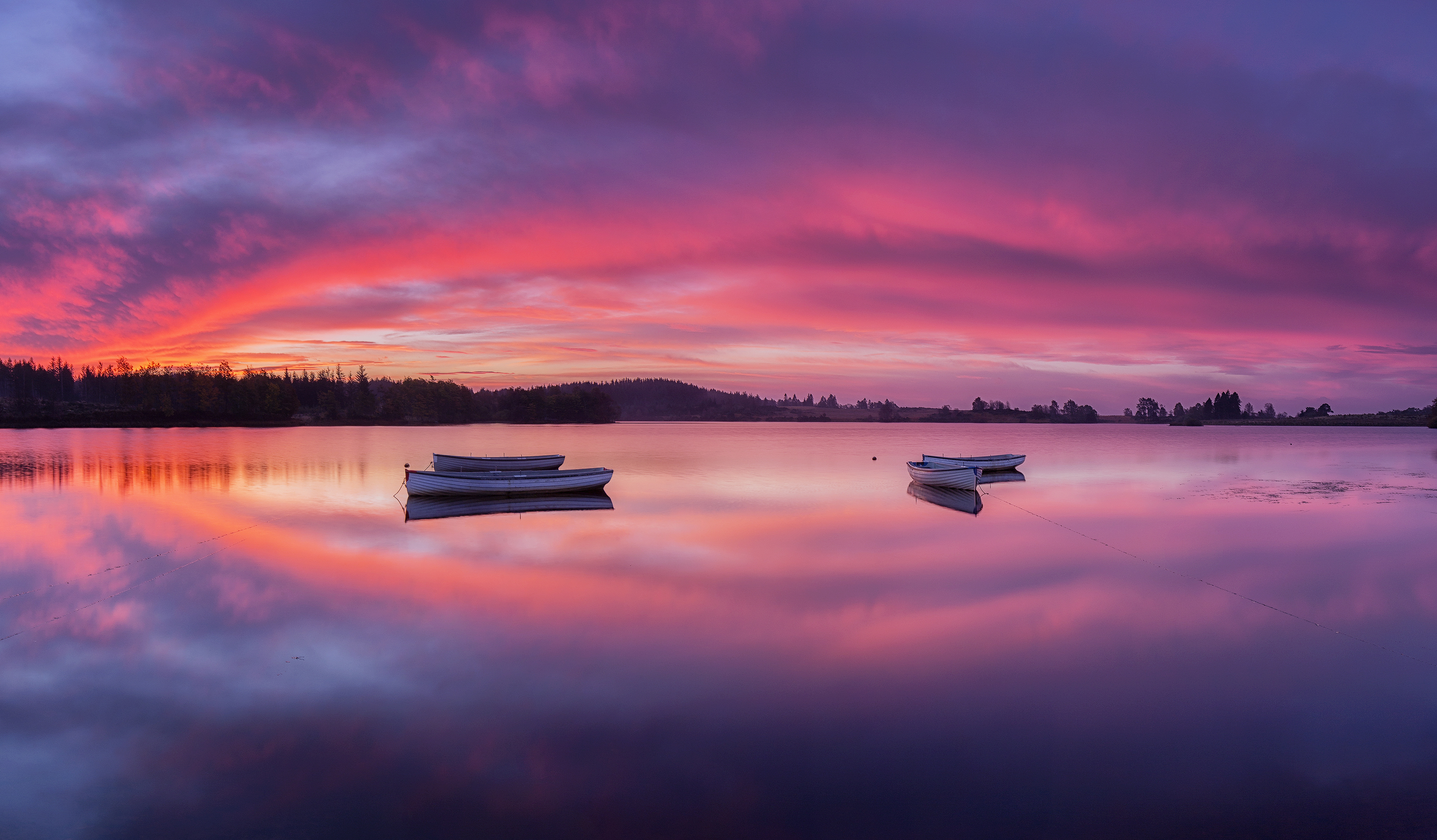Rowing boats on a lake at sunrise with colorful sky HD Wallpaper