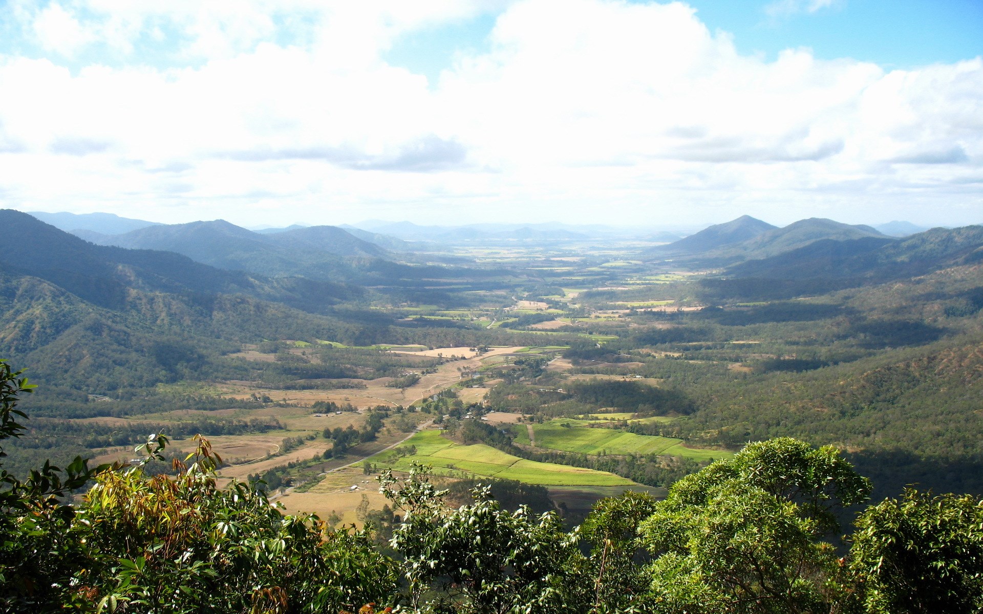 Panoramic view of a wide valley with rolling hills HD Wallpaper
