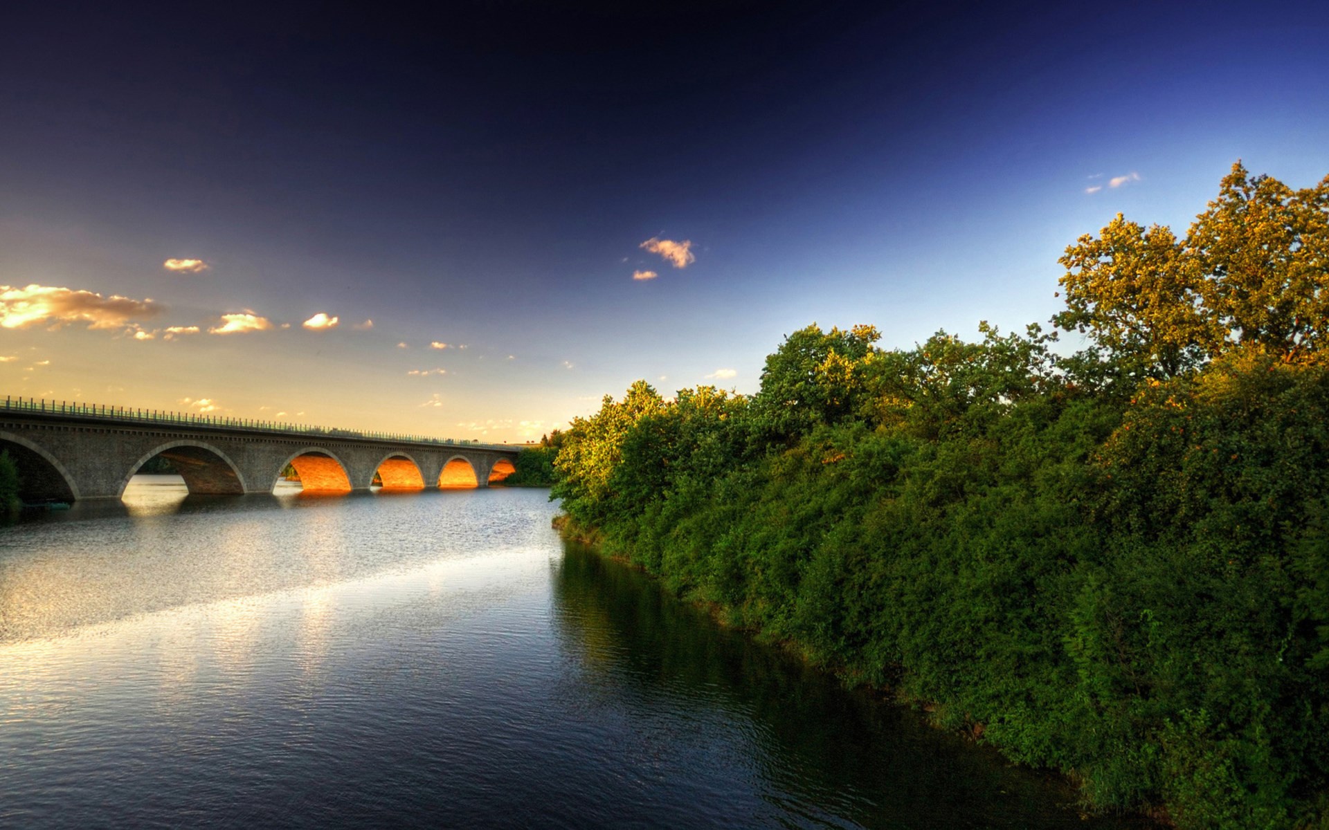 Bridge over a river with trees at sunset HD Wallpaper