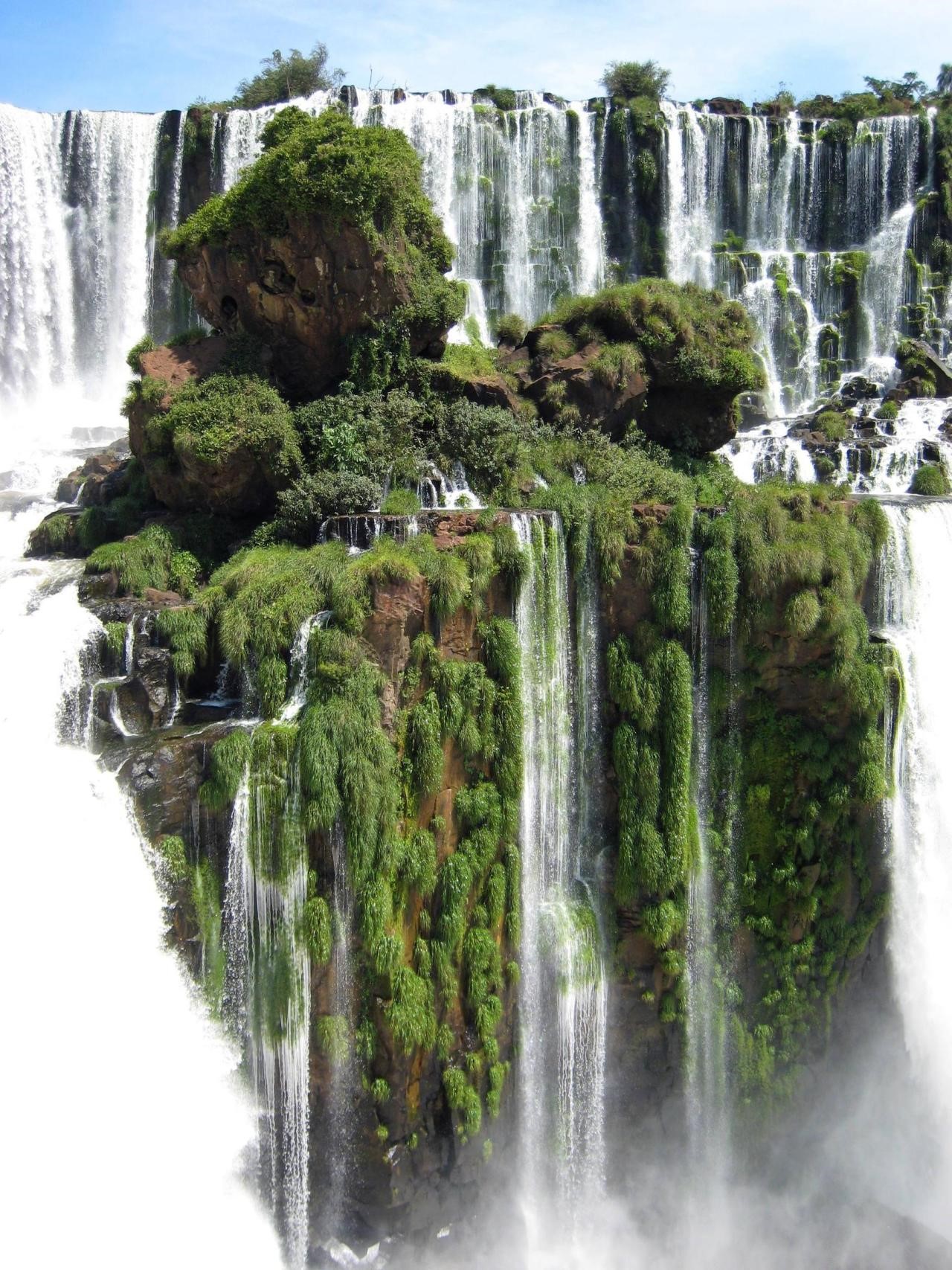 Iguazu Falls with lush green vegetation and rocks HD Phone Wallpaper