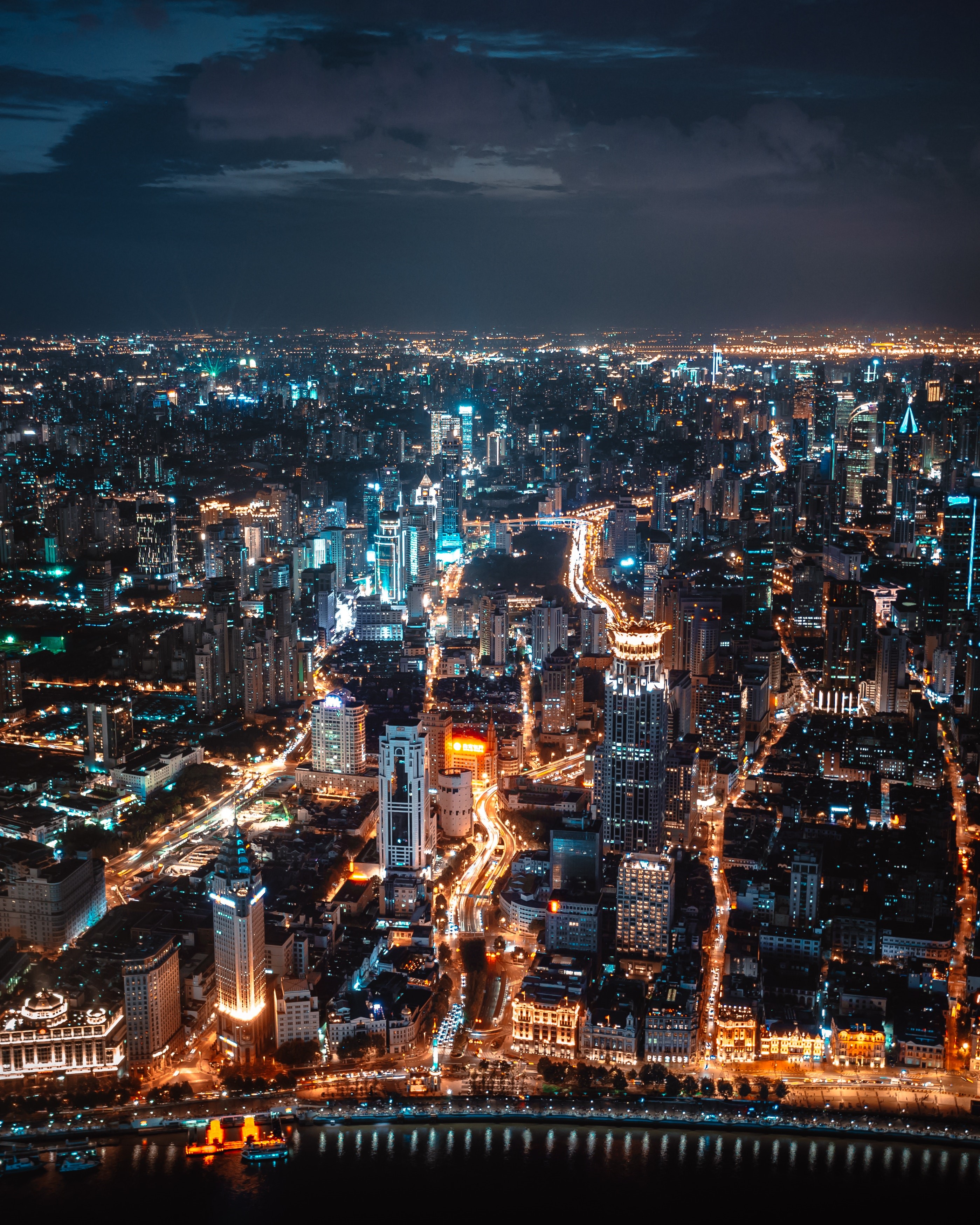 Aerial view of a city skyline at night HD Phone Wallpaper