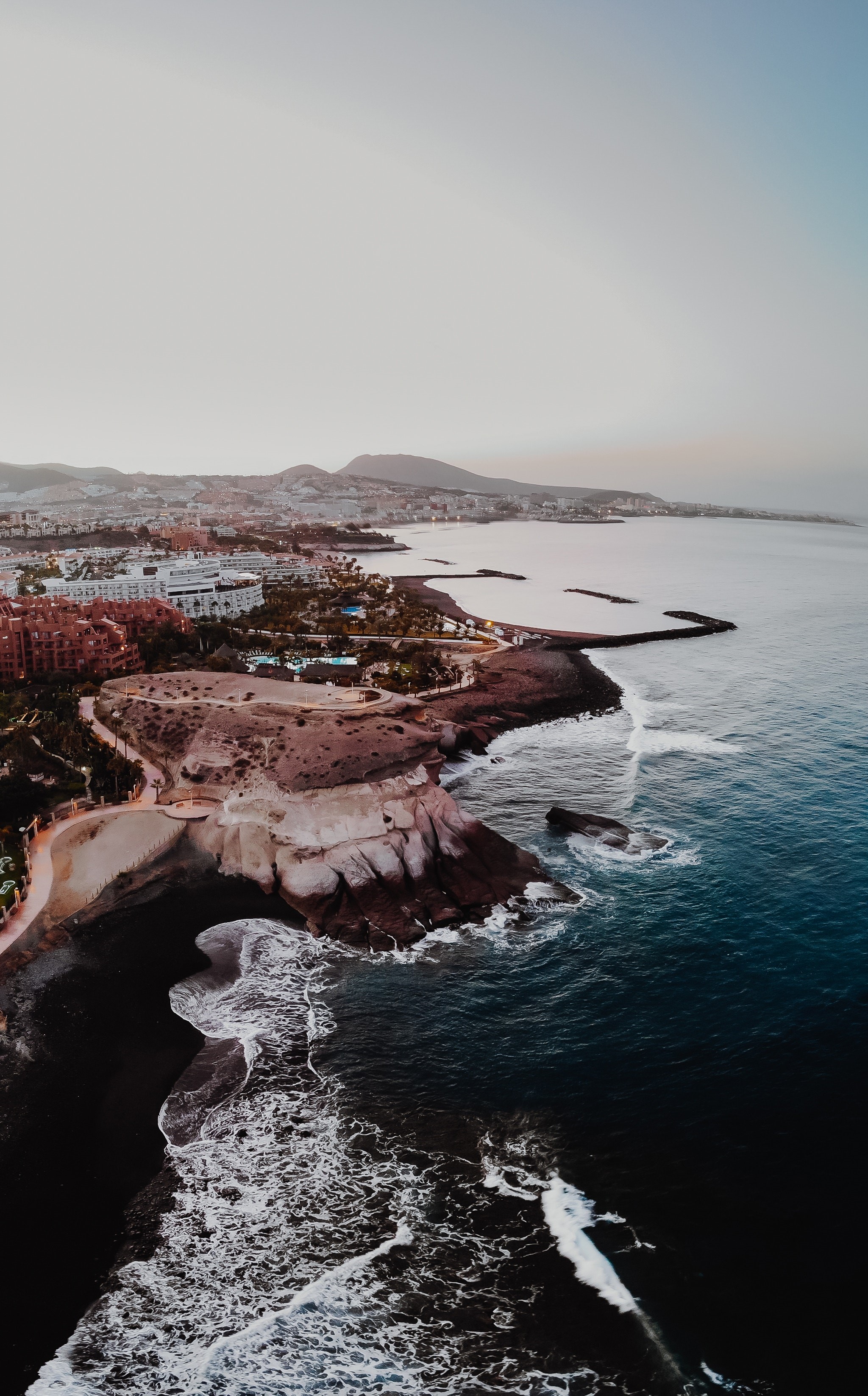 Aerial view of Tenerife coast with buildings and ocean HD Phone Wallpaper