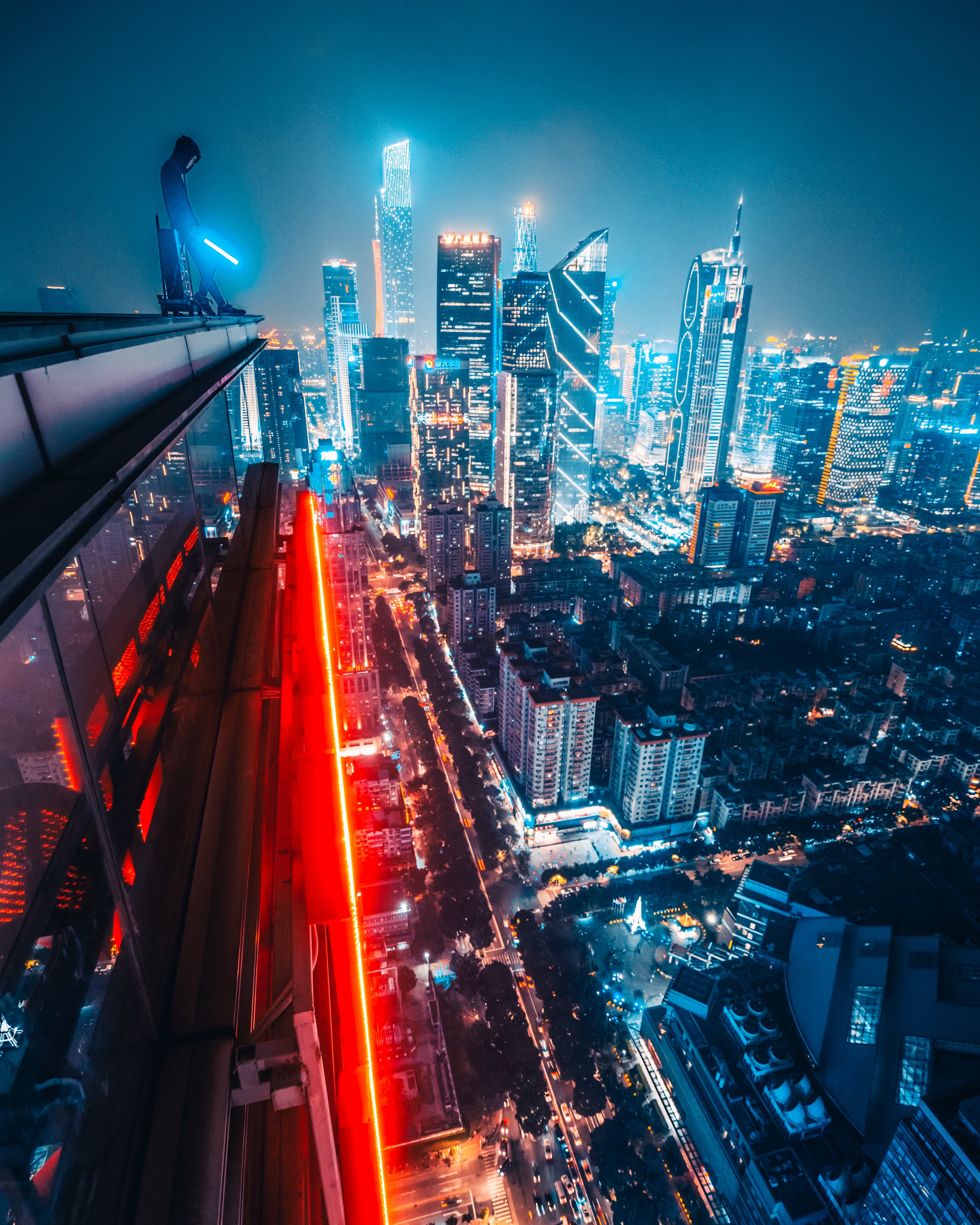 Man with Lightsaber on Guangzhou Rooftop HD Phone Wallpaper