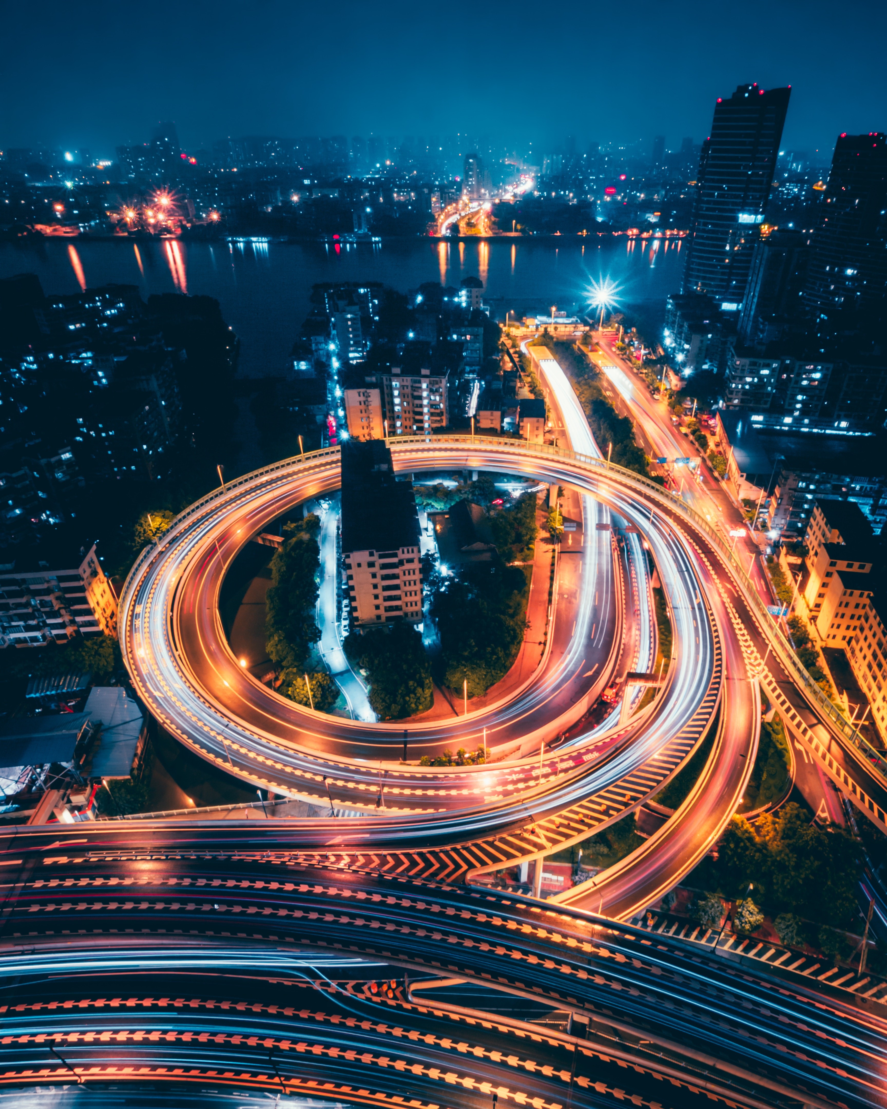 Aerial view of a busy highway interchange at night in China HD Phone Wallpaper