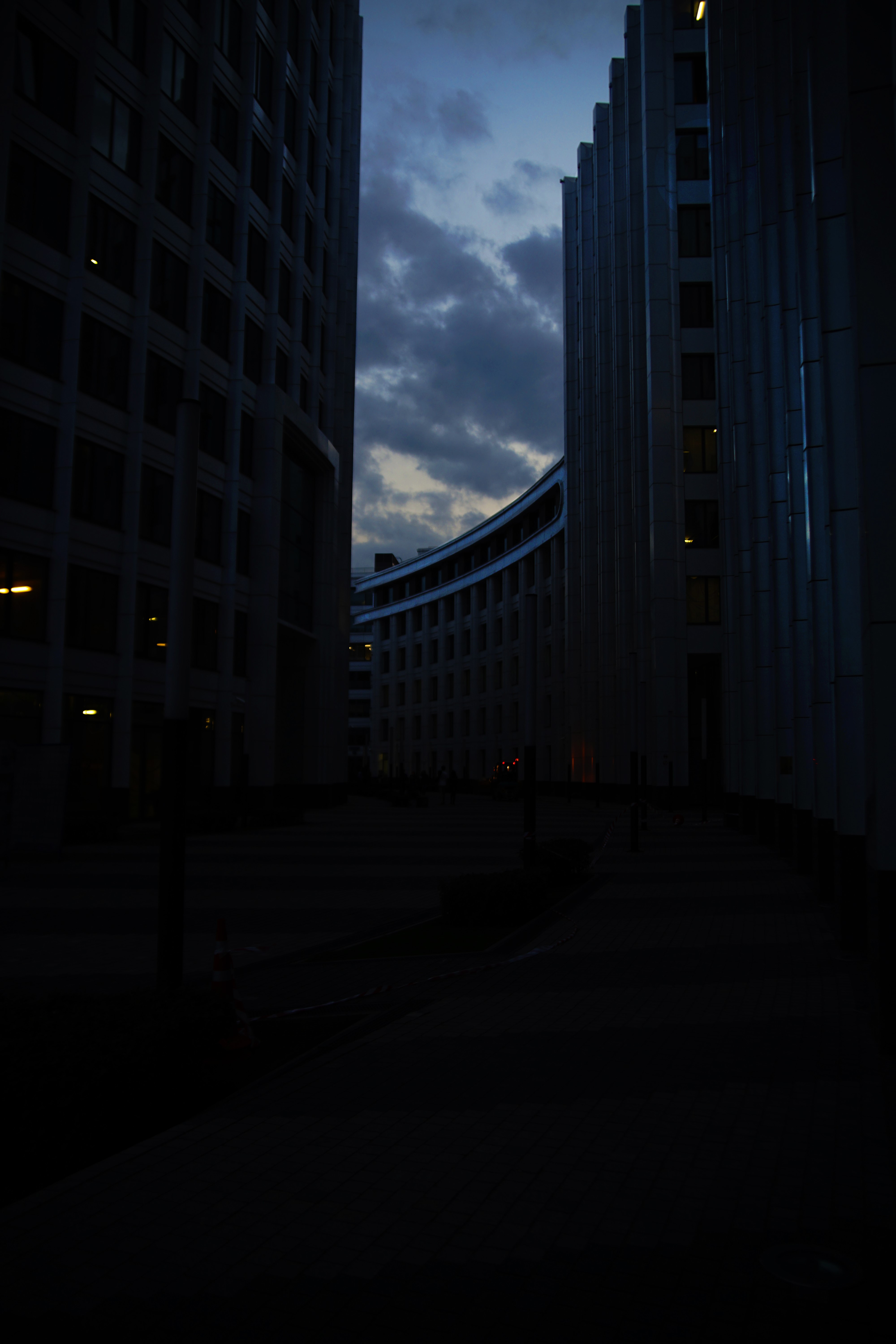 Modern buildings at dusk with cloudy sky HD Phone Wallpaper