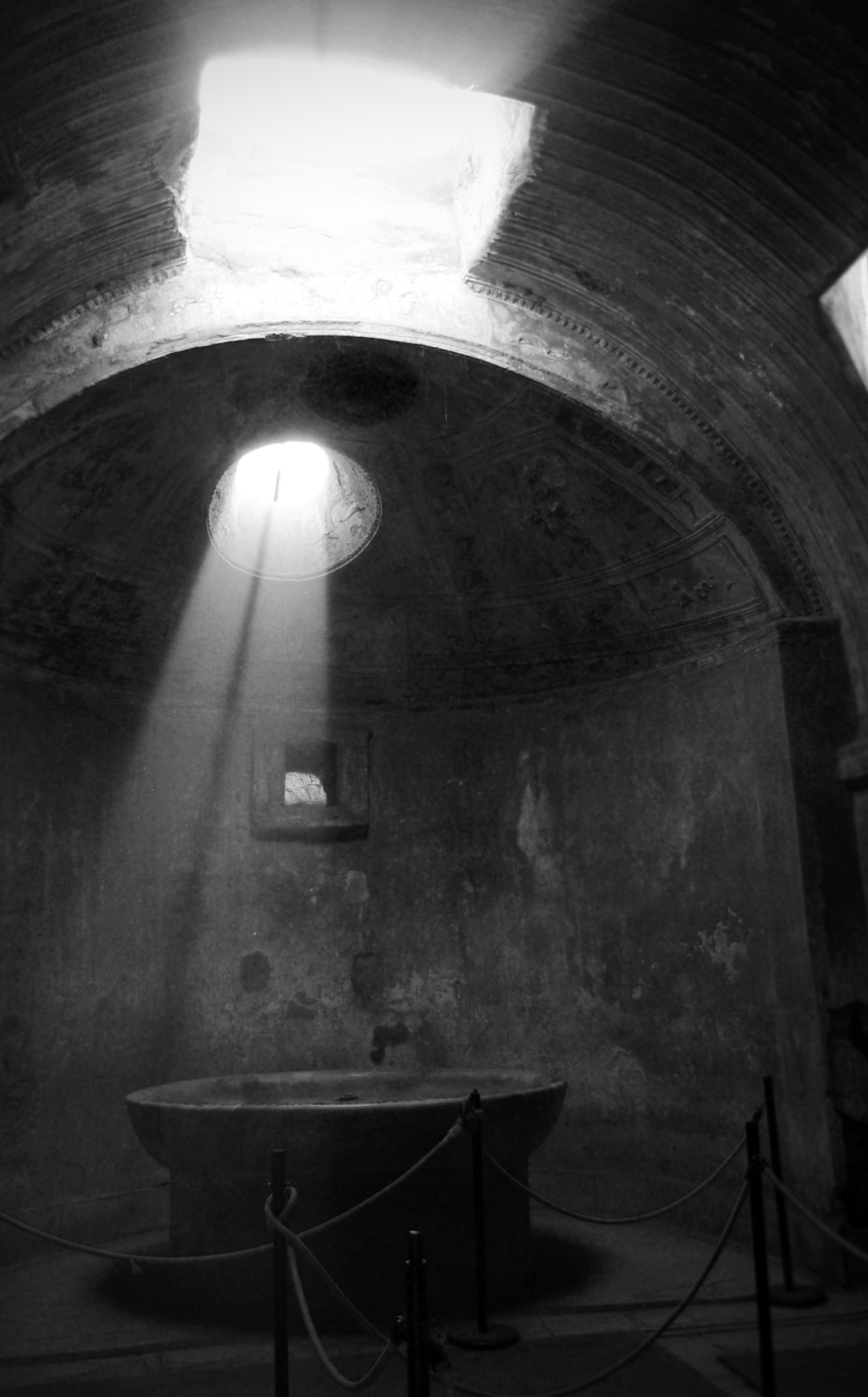 Ancient bath with sunlight streaming through openings HD Phone Wallpaper